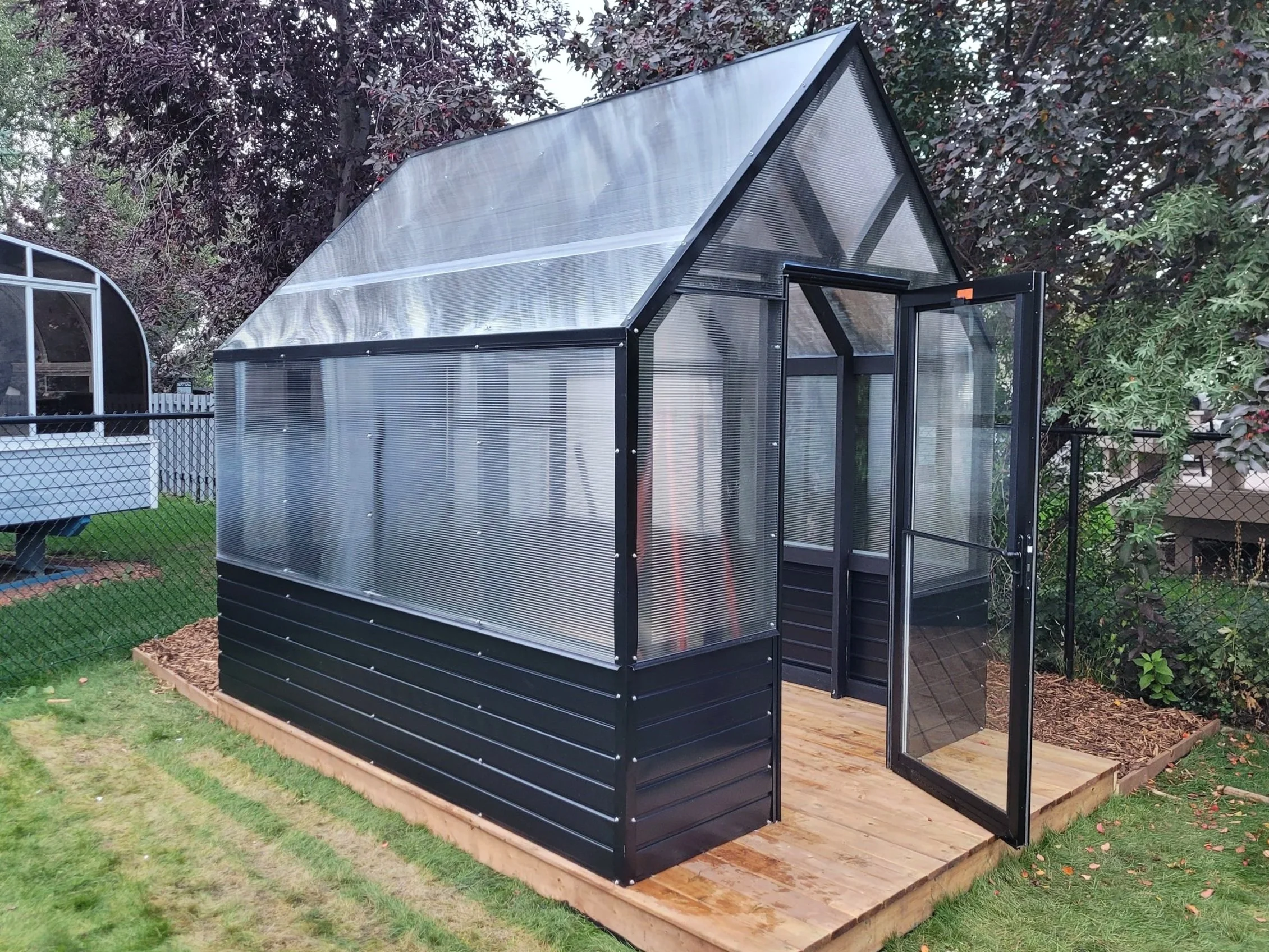 Custom wooden deck for greenhouse, decking, preassure treated lumber