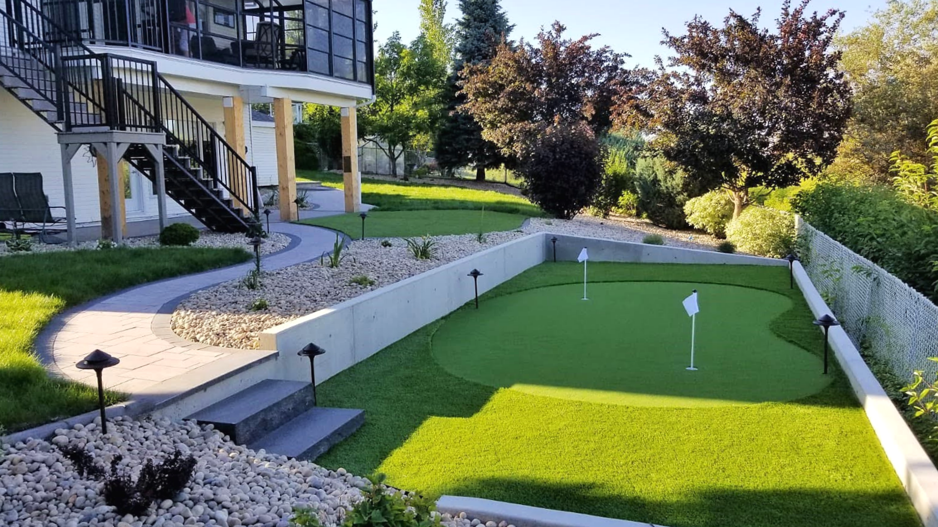 Concrete retaining walls, decorative stones, landscaping, SOD installation