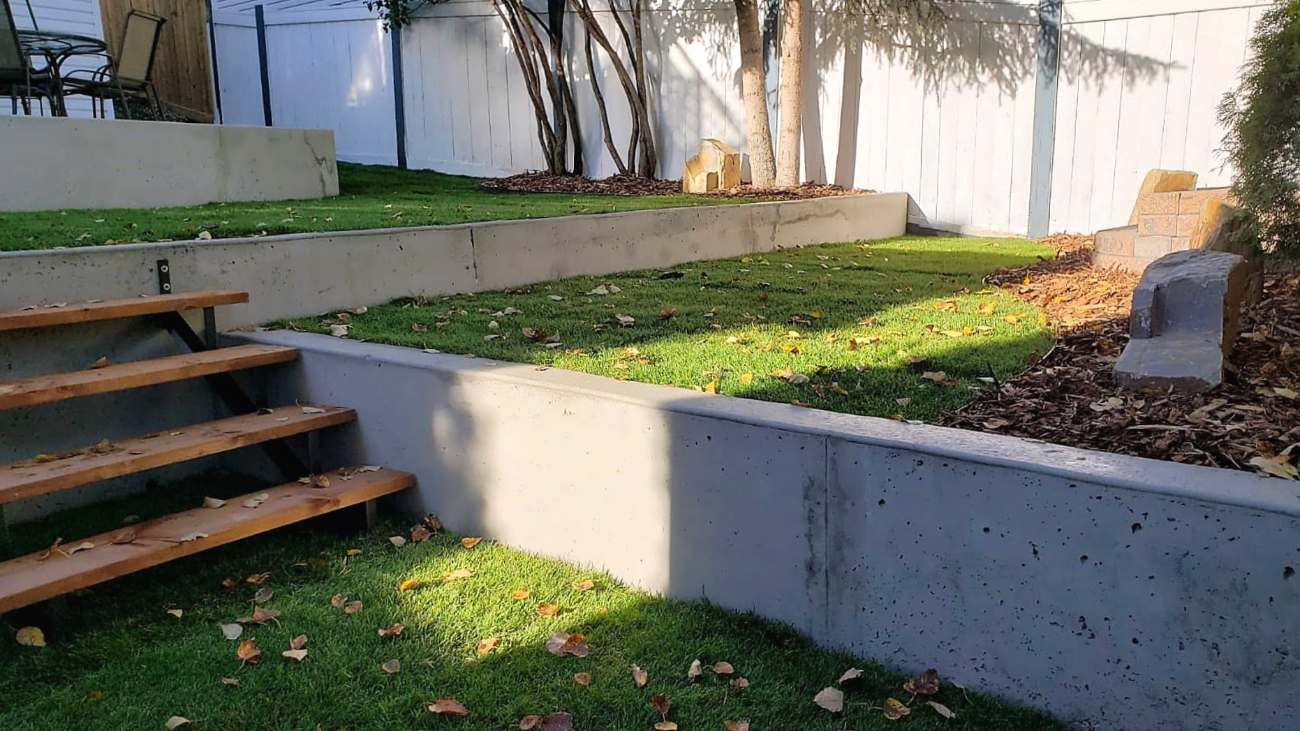 Concrete retaining walls, decorative stones, landscaping, SOD installation