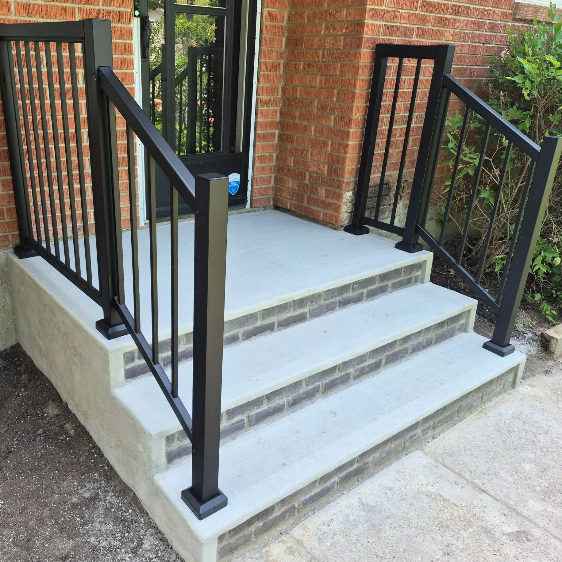 Concrete porch, concrete stairs, aluminum railing