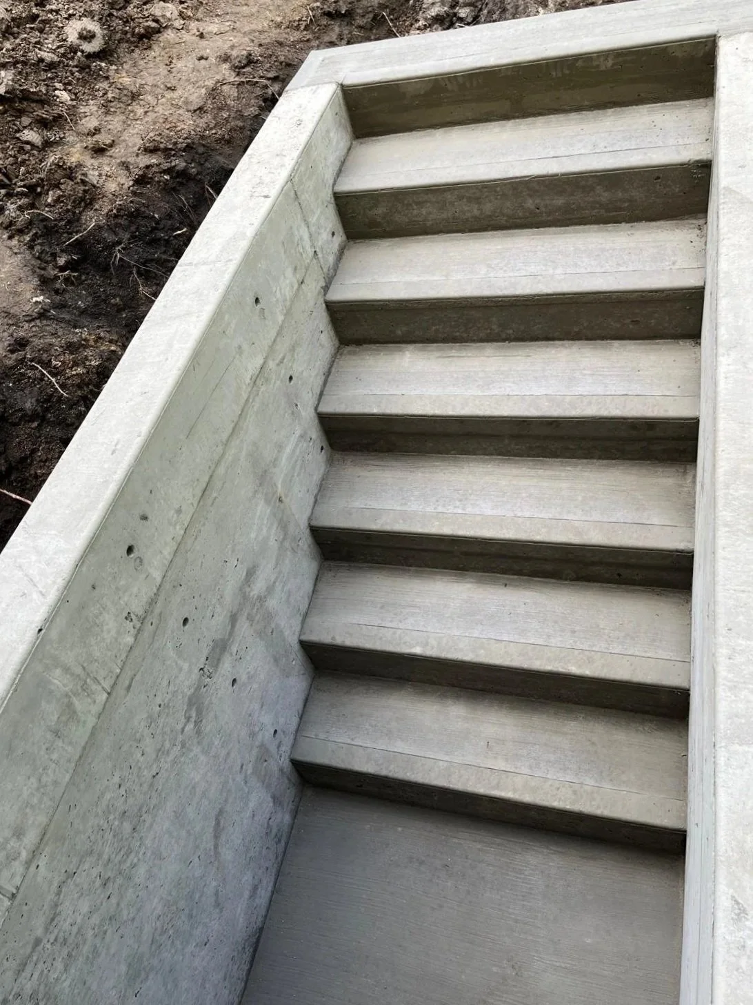 Concrete basement stairs, concrete retaining walls, concrete walls