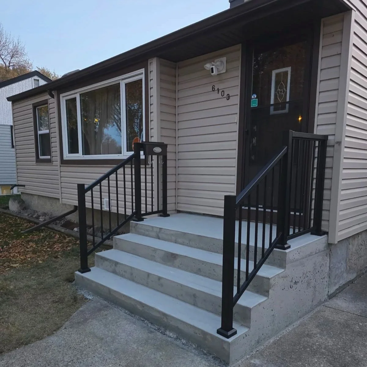 Concrete stairs, concrete porch, aluminum railing, concrete walkway