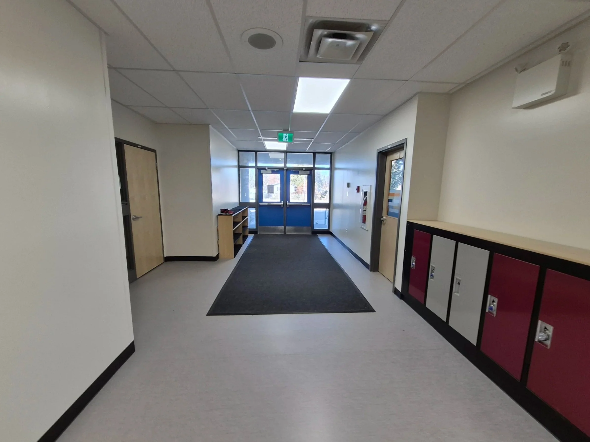 Interior renovation of a school hallway: walls, ceiling, floor, lockers installation