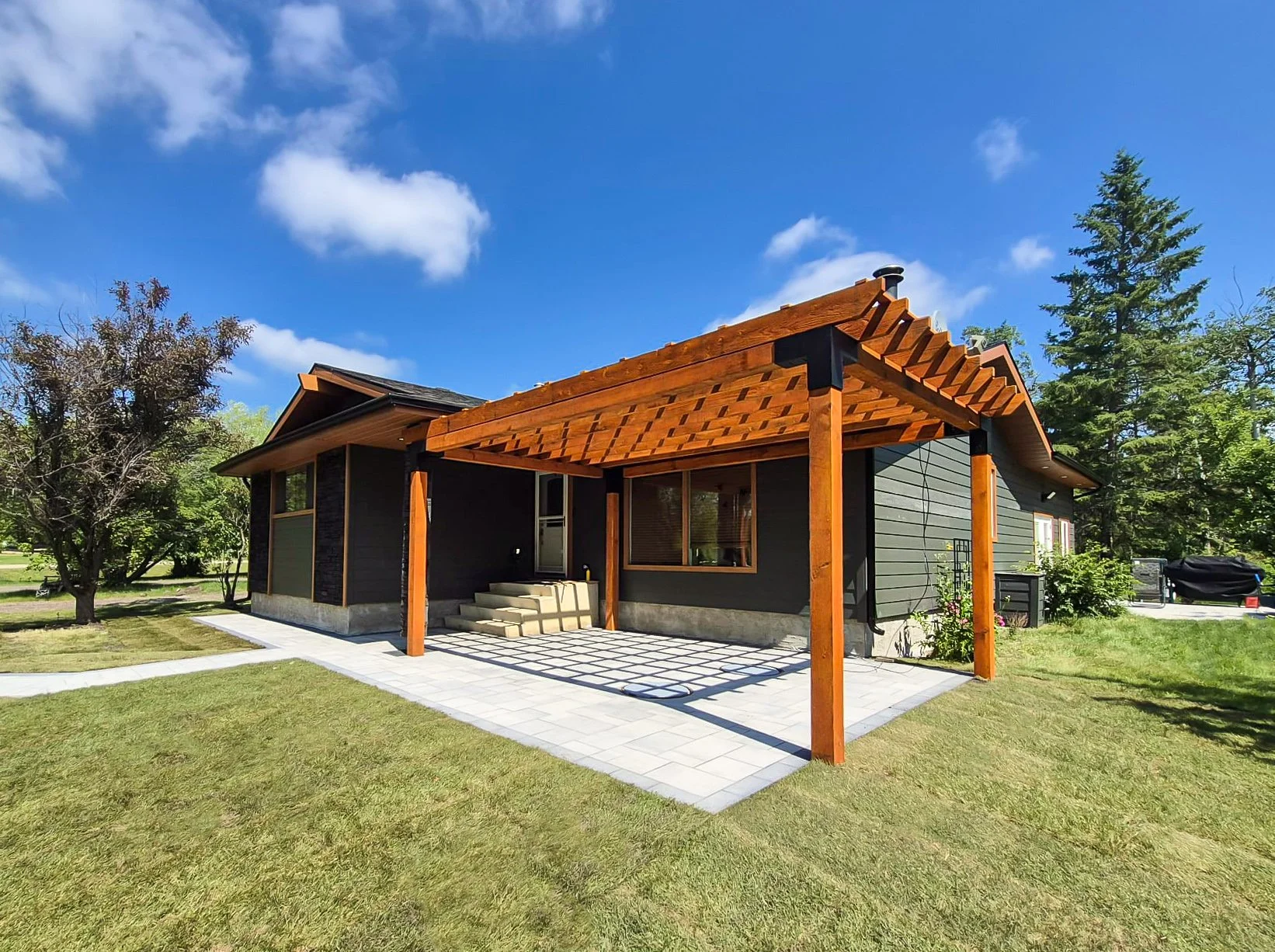 Wooden pergola, paving stones, SOD, pavers, paver patio