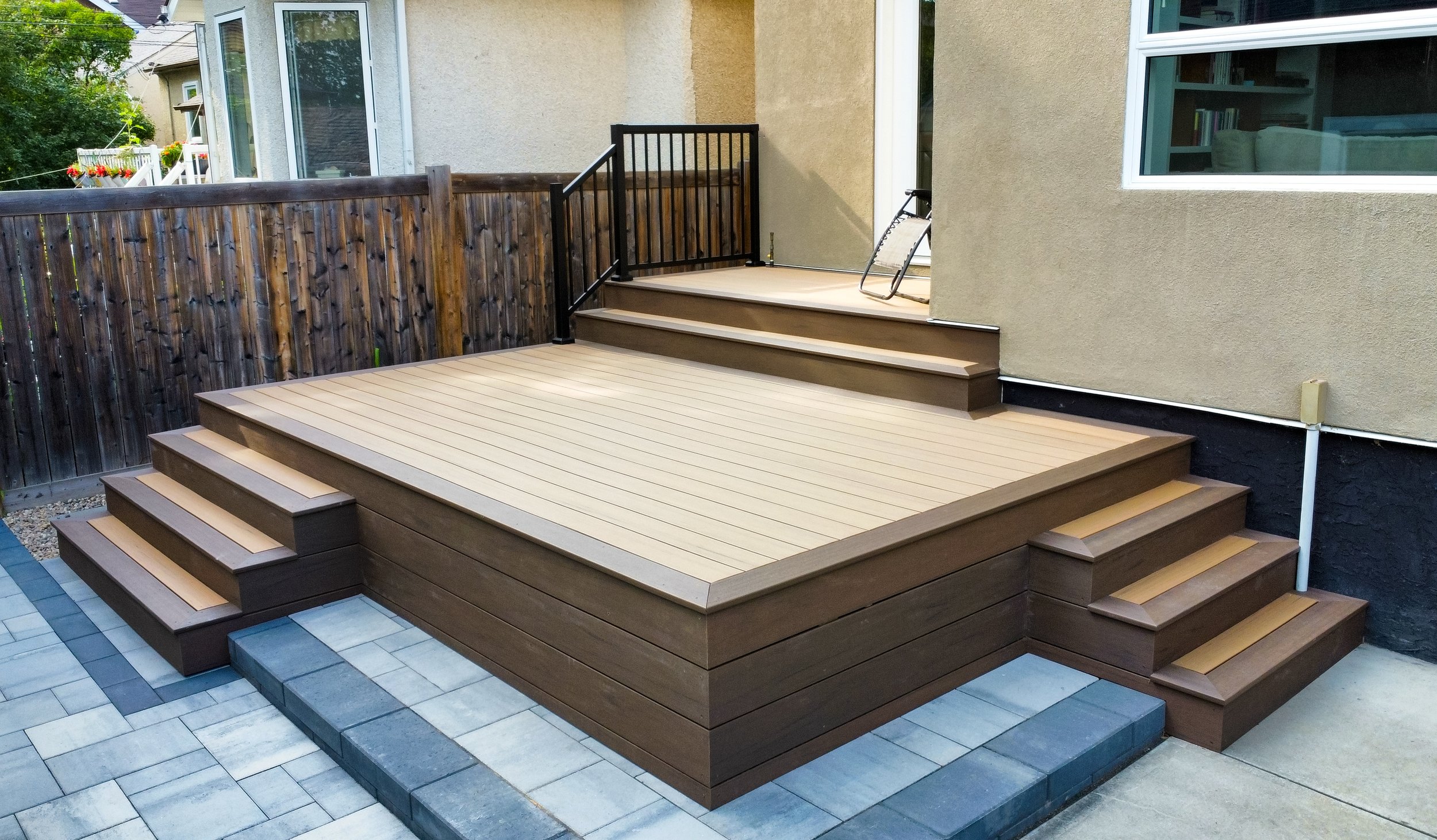 Composite deck with steps, two-tier deck, pavers patio, paving stones