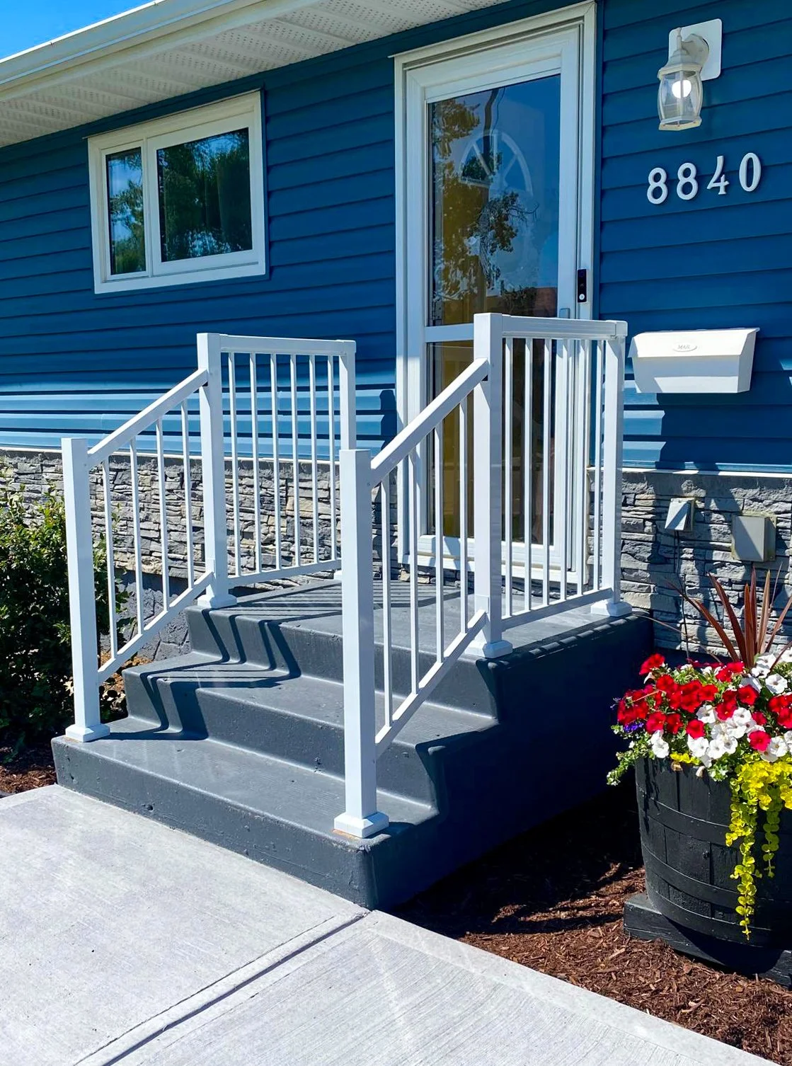 Aluminum railing for front porch, concrete walkway