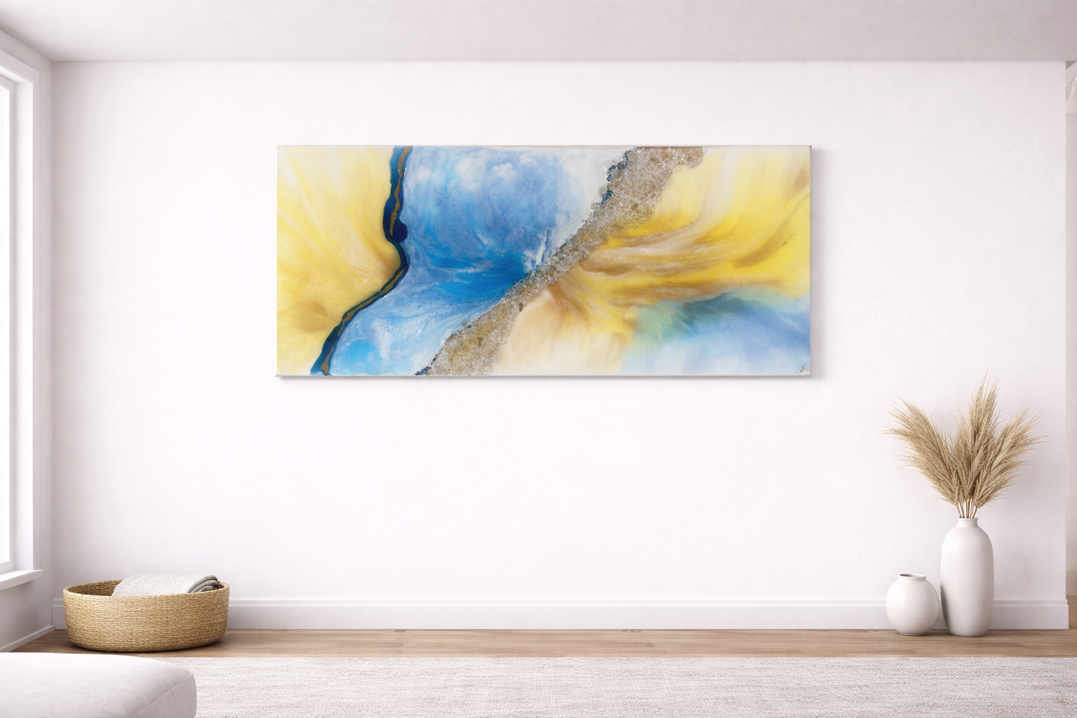 Abstract blue and yellow painting on a white wall in a minimalist room with a wicker basket on the floor and vases with dried plants.