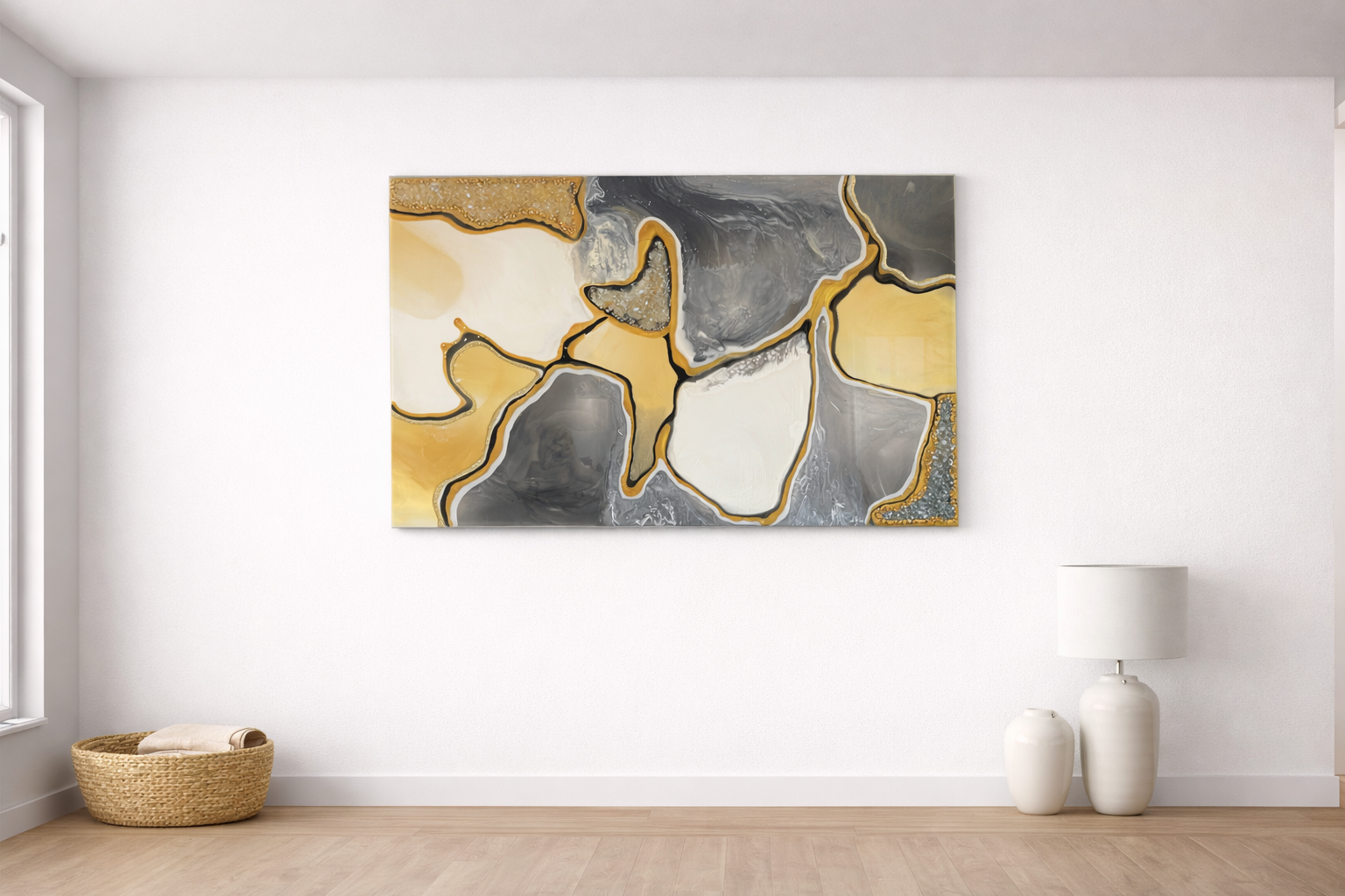 Modern abstract painting with yellow, gray, and white flowing shapes on a white wall in a minimalist room.