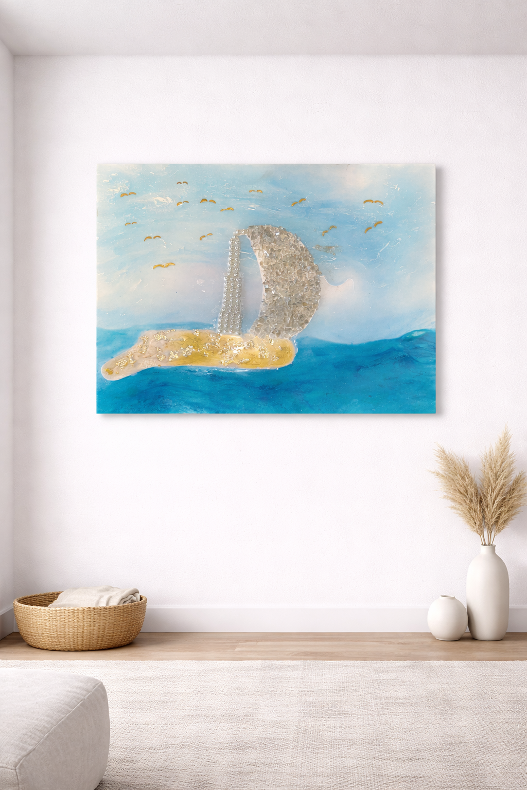 Abstract painting of the London Tower Bridge on a light blue sky with seagulls, displayed on a white wall in a minimalist room with a wicker basket, vases, and dried grass arrangement.