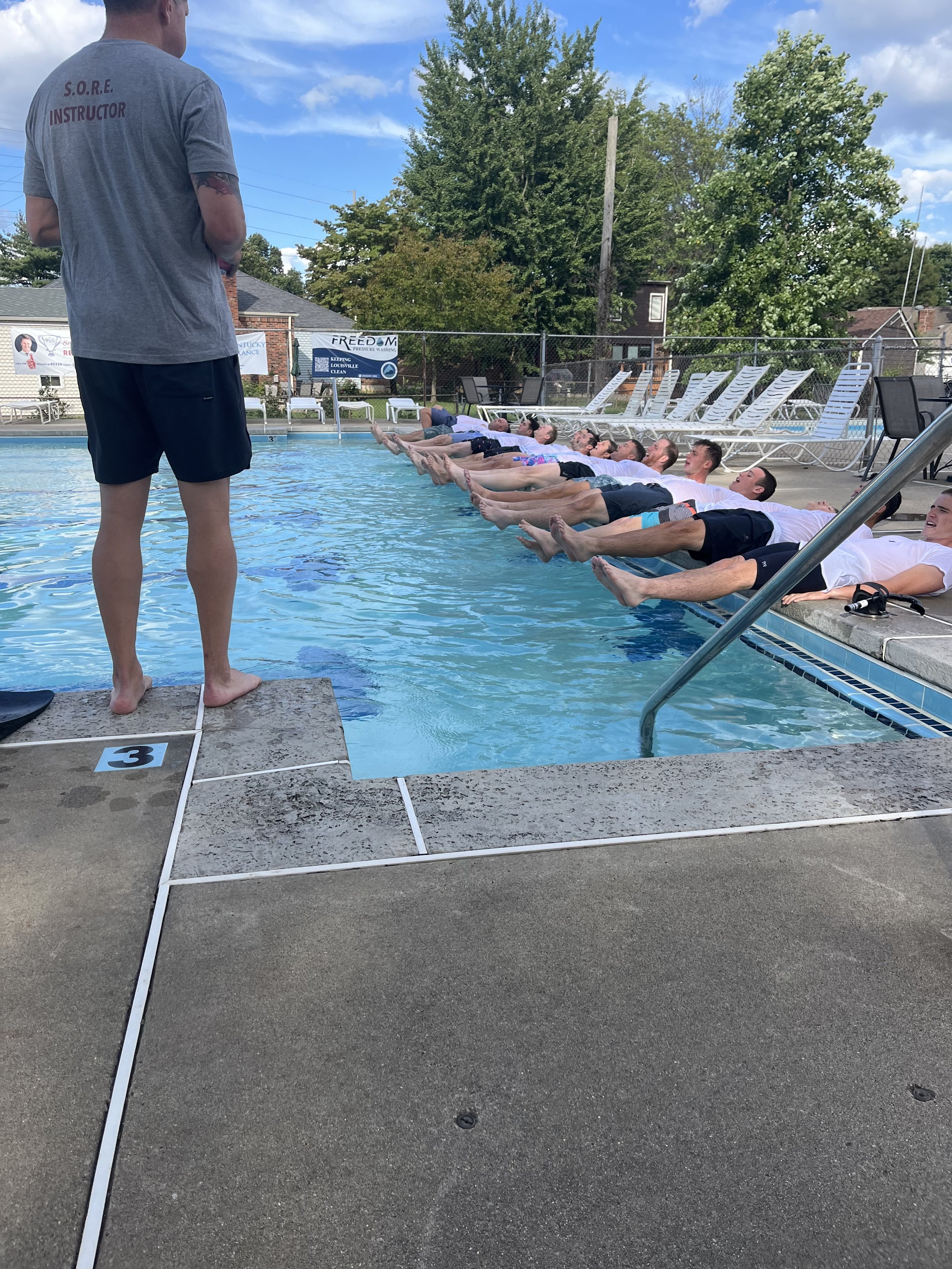 SORE instructor leading a team through water confidence training