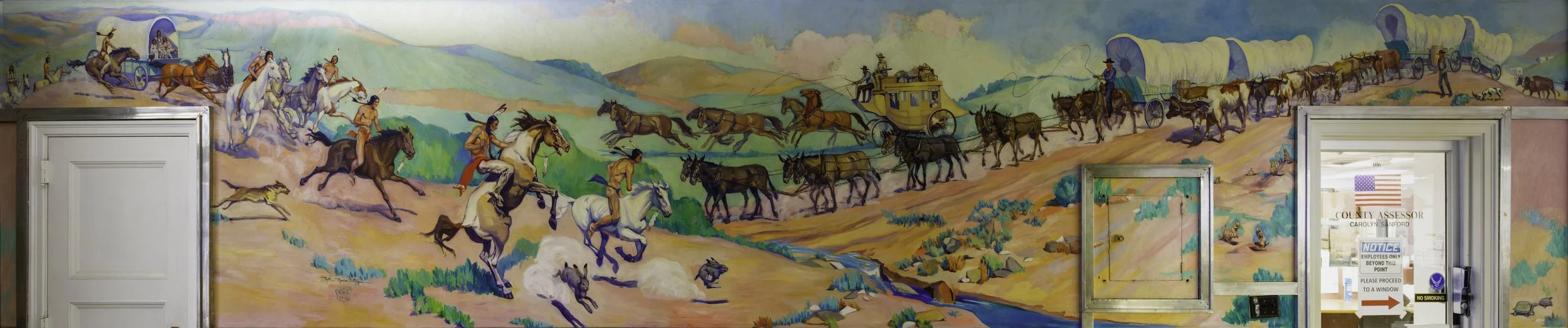 Mural depicting a historical scene of Native Americans on horseback, leading buffalo herds and early settlers with covered wagons through a colorful landscape with mountains and a stream.