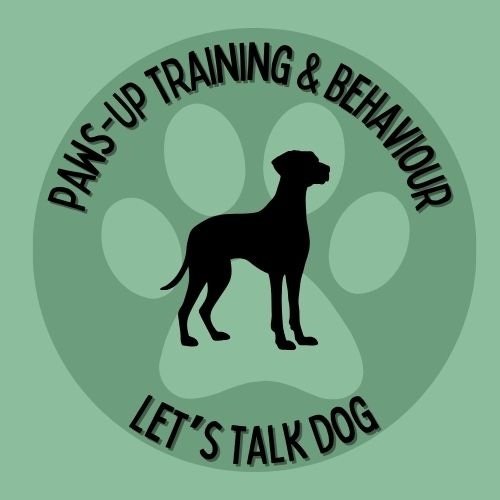 Logo for Paws-Up Training & Behaviour with a green background featuring a black dog silhouette sitting inside a large paw print.