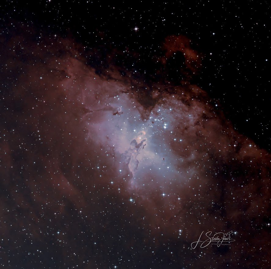 Starfield with red and blue nebula.