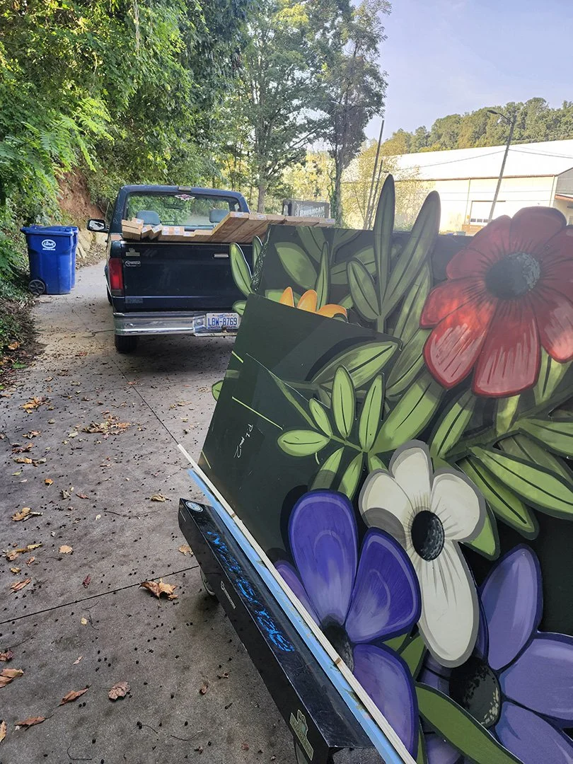 35. MARQUEE GRAND REOPENING FLOWERS leaving shop.jpg