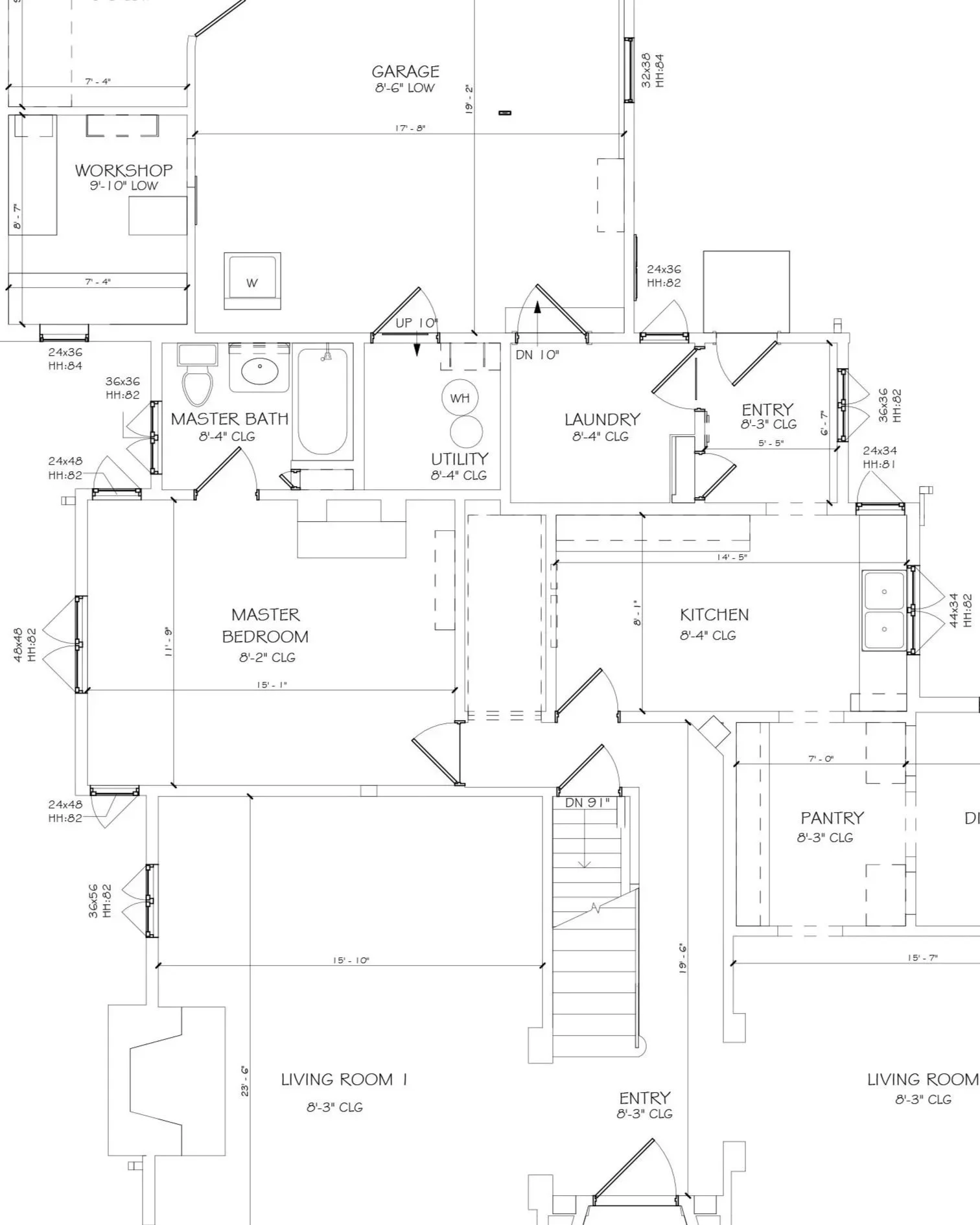 A detailed architectural floor plan of a house, indicating various rooms and their dimensions, including garage, workshop, master bath, master bedroom, utility room, laundry, pantry, and living rooms, with door and window placements.