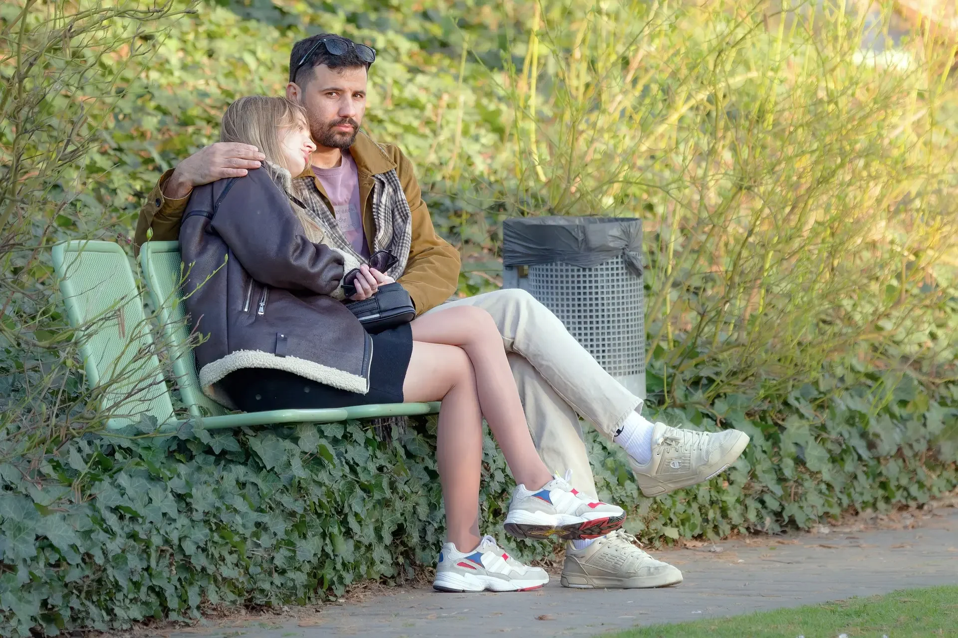 Couple sitting together with subtle emotional distance, showing recurring relationship patterns in New York City