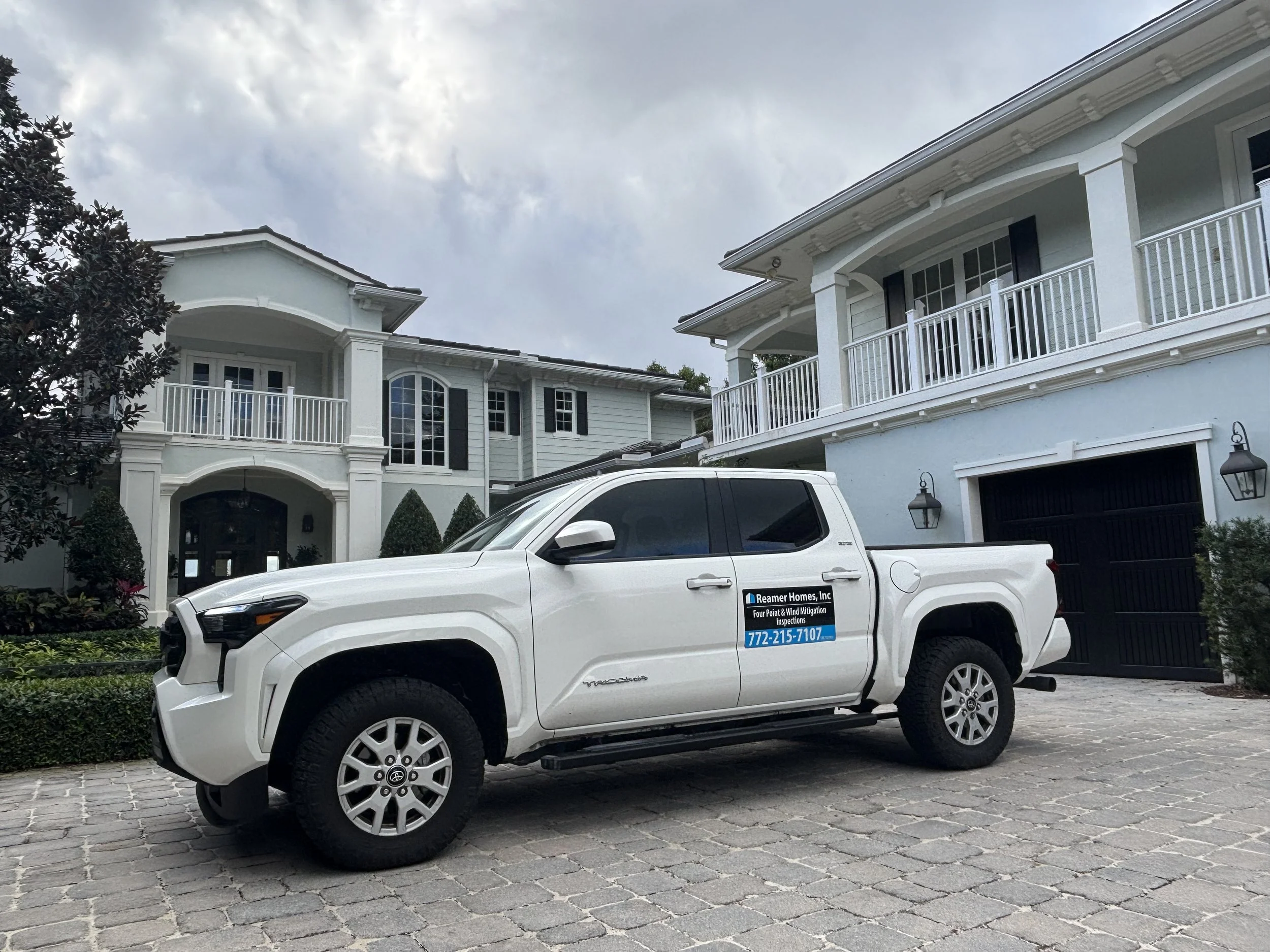 Reamer Homes service truck at a customer’s home for a scheduled wind mitigation inspection.