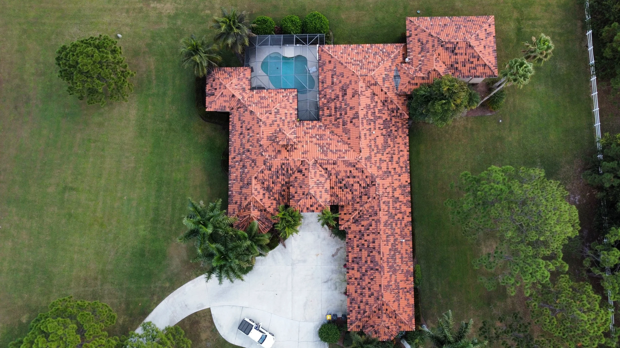 Aerial view of a Florida home with pool showing roof features evaluated during a wind mitigation inspection.
