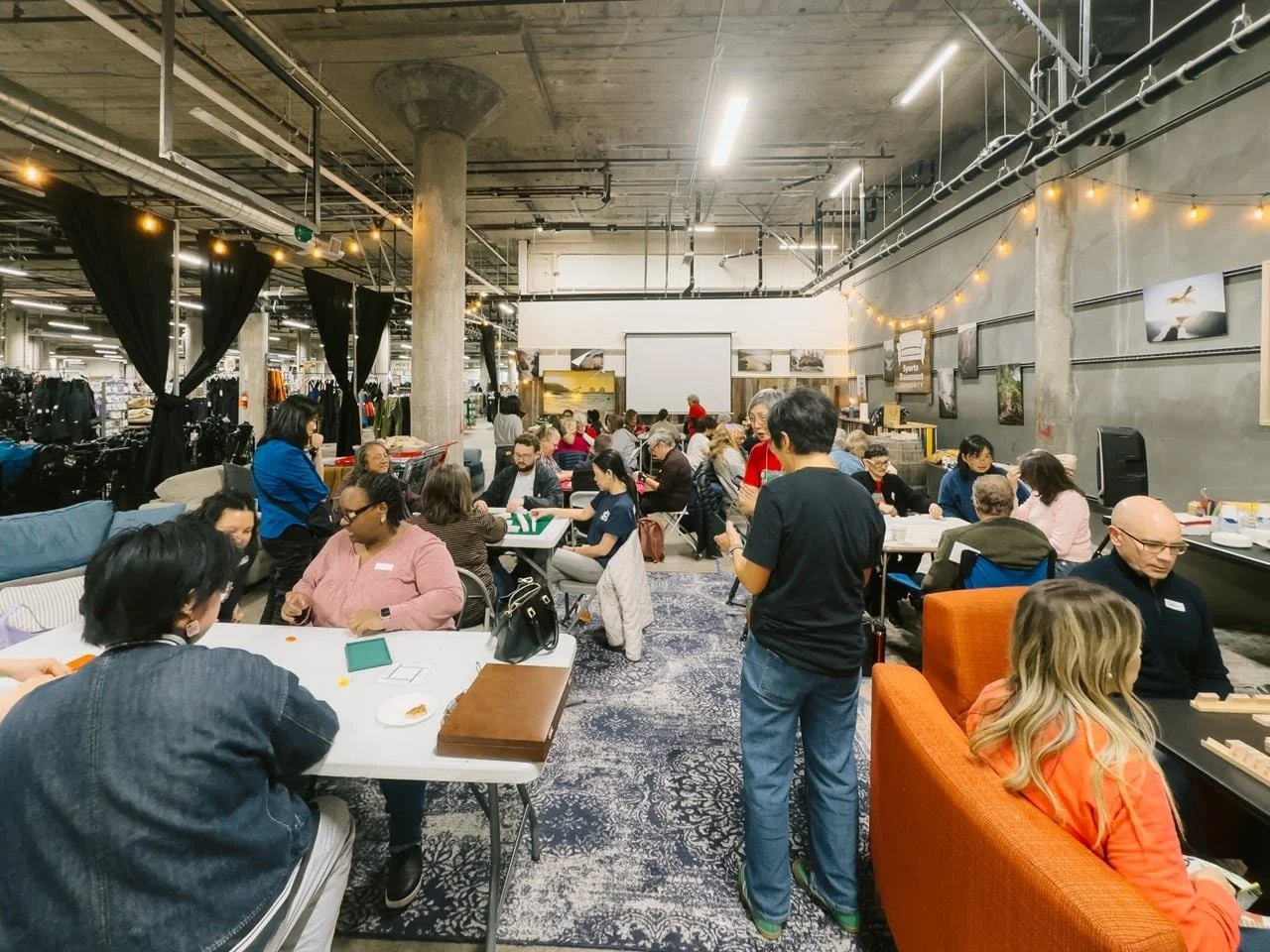 People playing mahjong in Sportsbasement Stonestown Mall in San Francisco