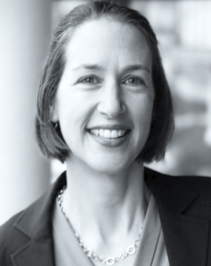 Dorothea Gioe, a woman with short hair and a smile.