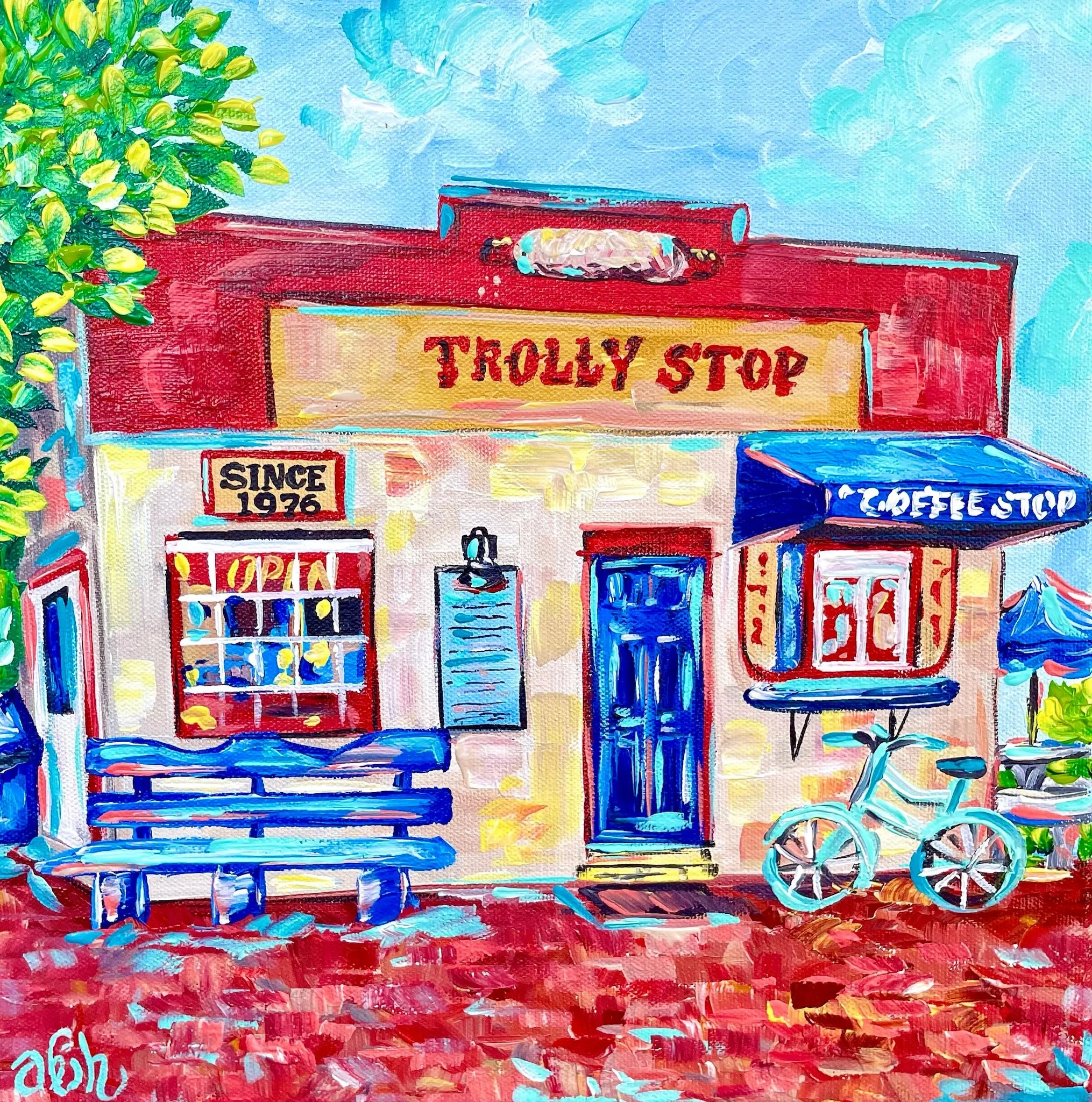Colorful painting of a small establishment called Trolley Stop with a red and cream facade, blue door, outdoor blue bench, and a light blue bicycle parked outside. The sign indicates it has been open since 1976 and features a blue awning with white l