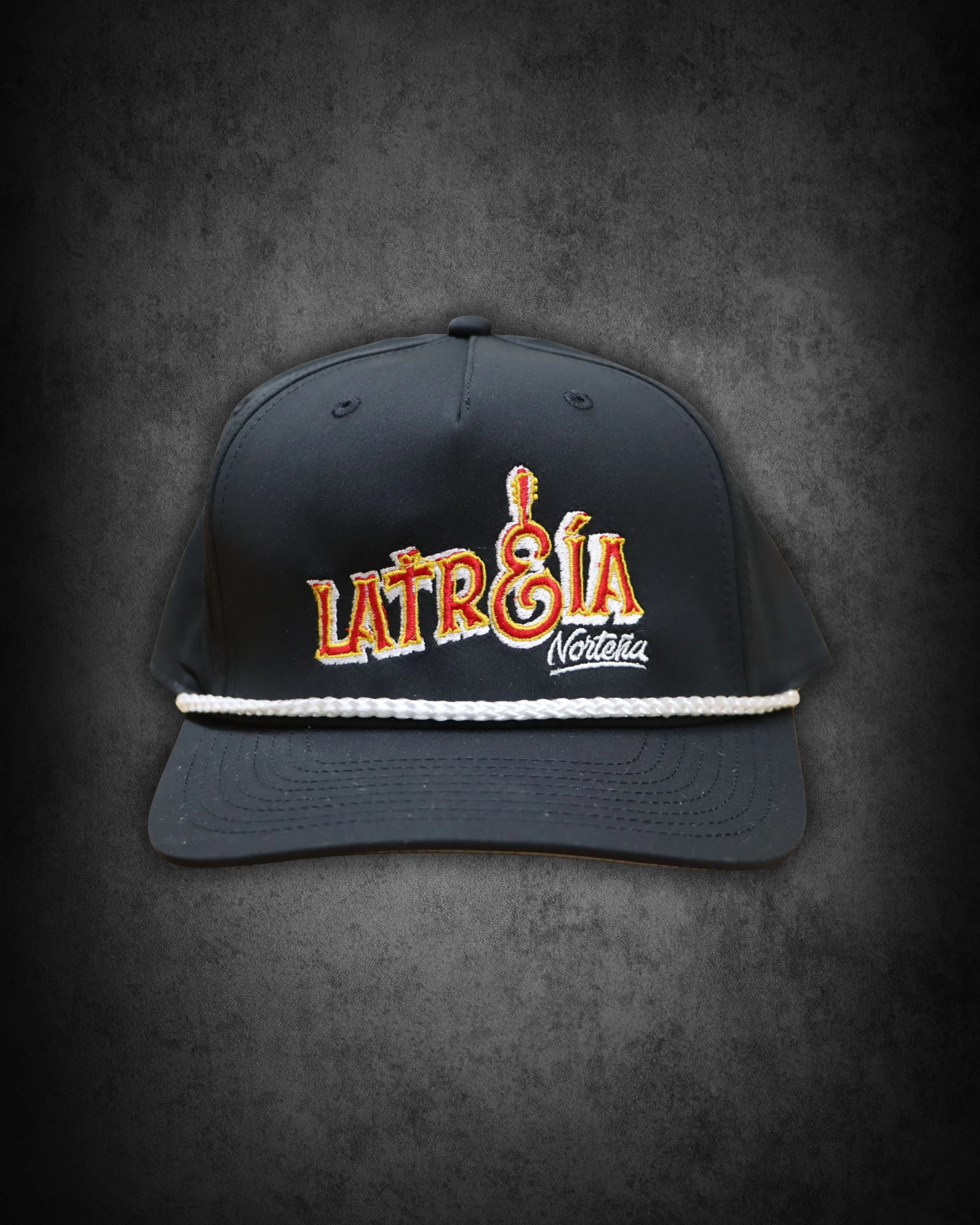 A baseball cap with embroidered text reading "LA TRESOL" and "Northern" on a dark background.
