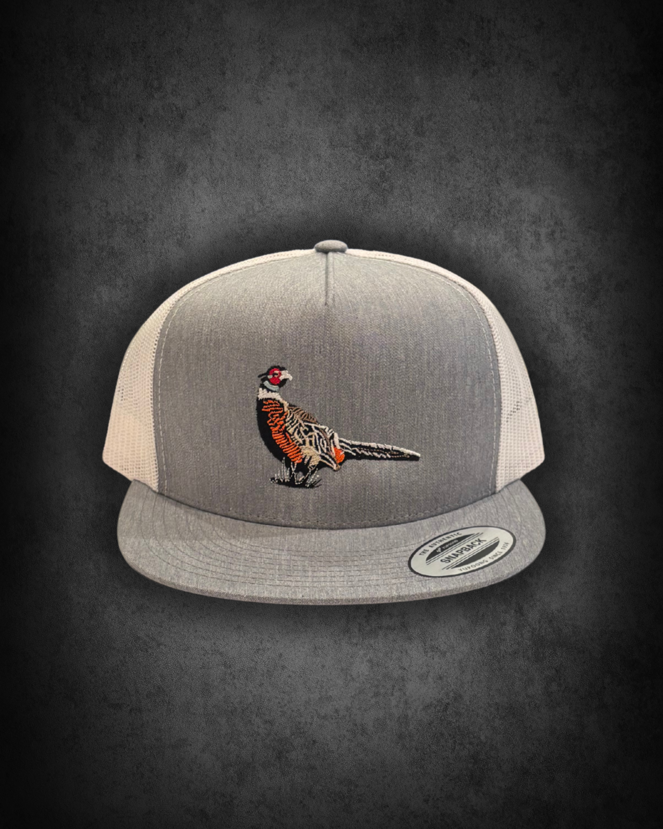 Gray hockey cap with an embroidered tiger on the front, displayed against a black background.