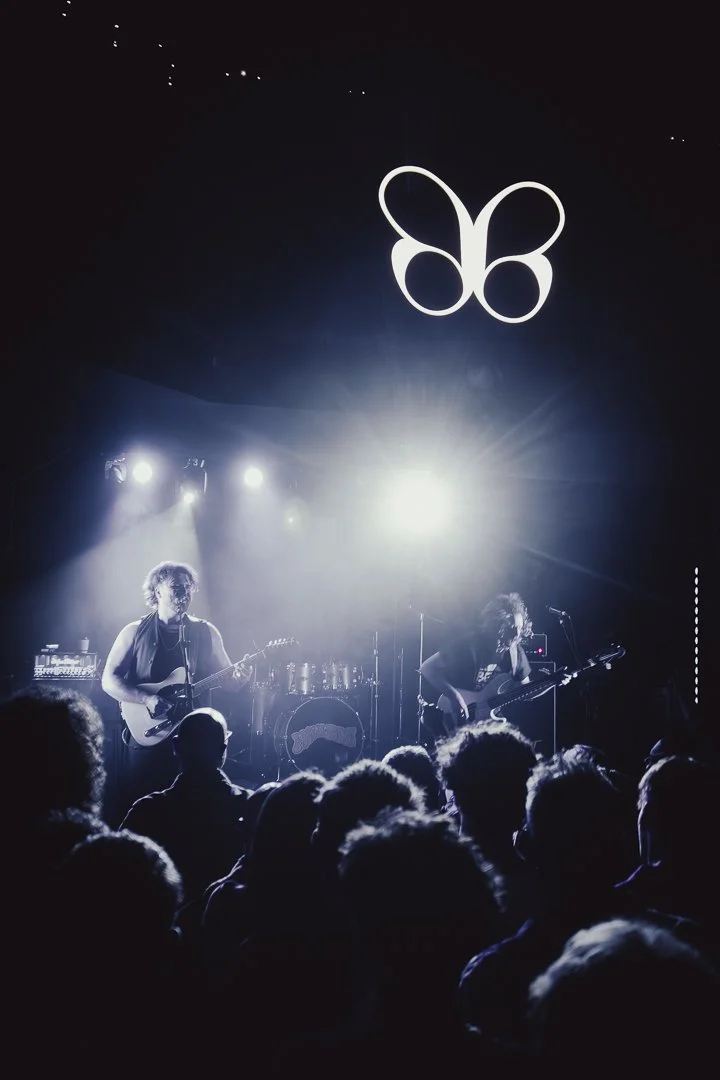 High-octane live band photography featuring High Fade in Southampton in pale blue.