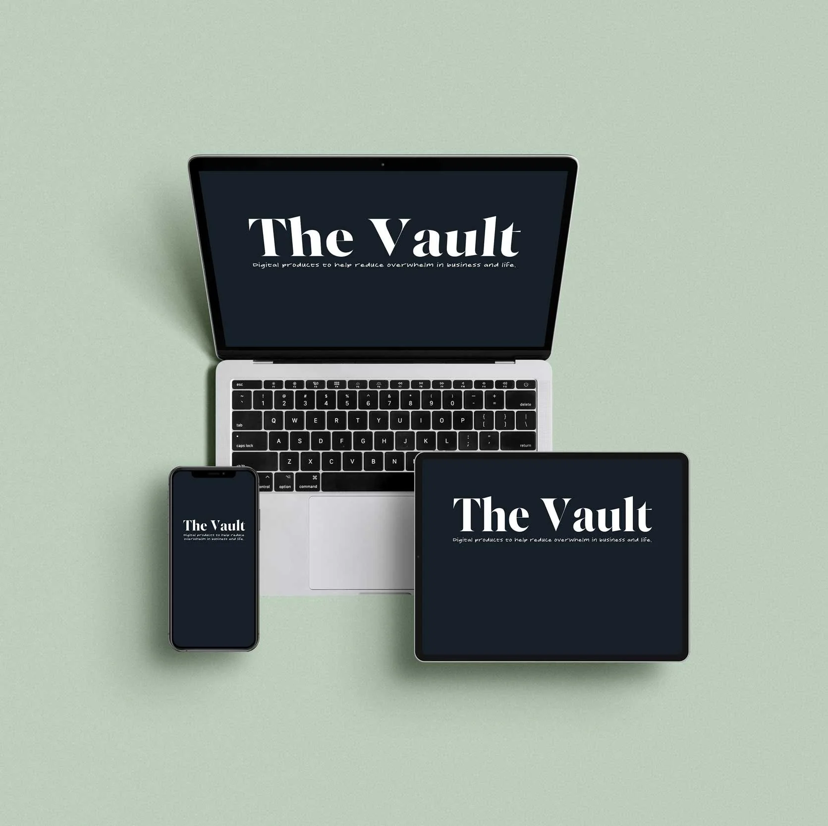 A laptop, smartphone, and tablet on a light green surface, each displaying a black screen with white text that reads 'The Vault' and a subtitle about digital products to help reduce overwhelm in business and life.