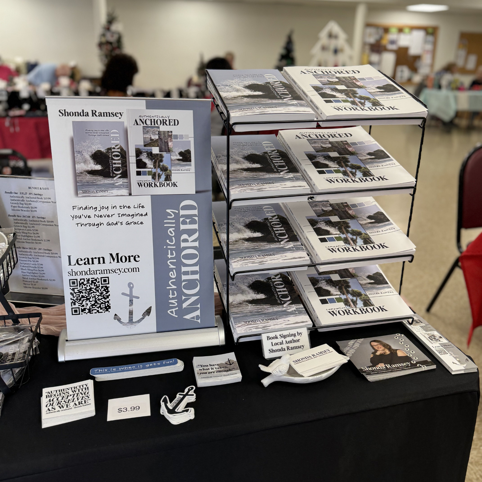books and table sign for authentically anchored