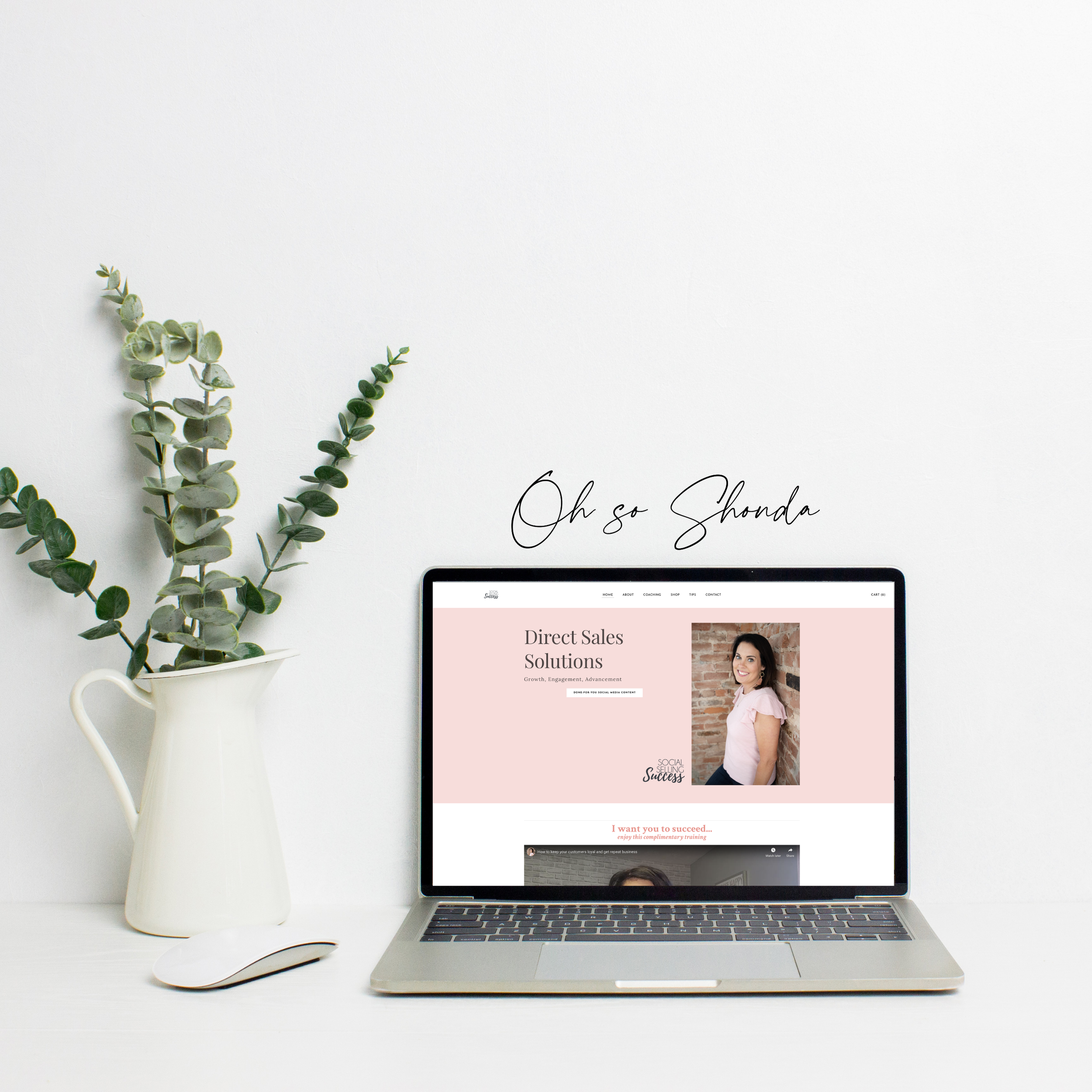 laptop and pitcher of eucalyptus leaves