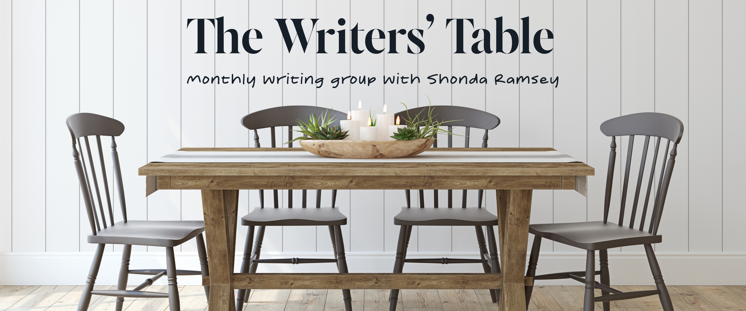 Table and chairs with a wooden bowl of candles on the table and greenery