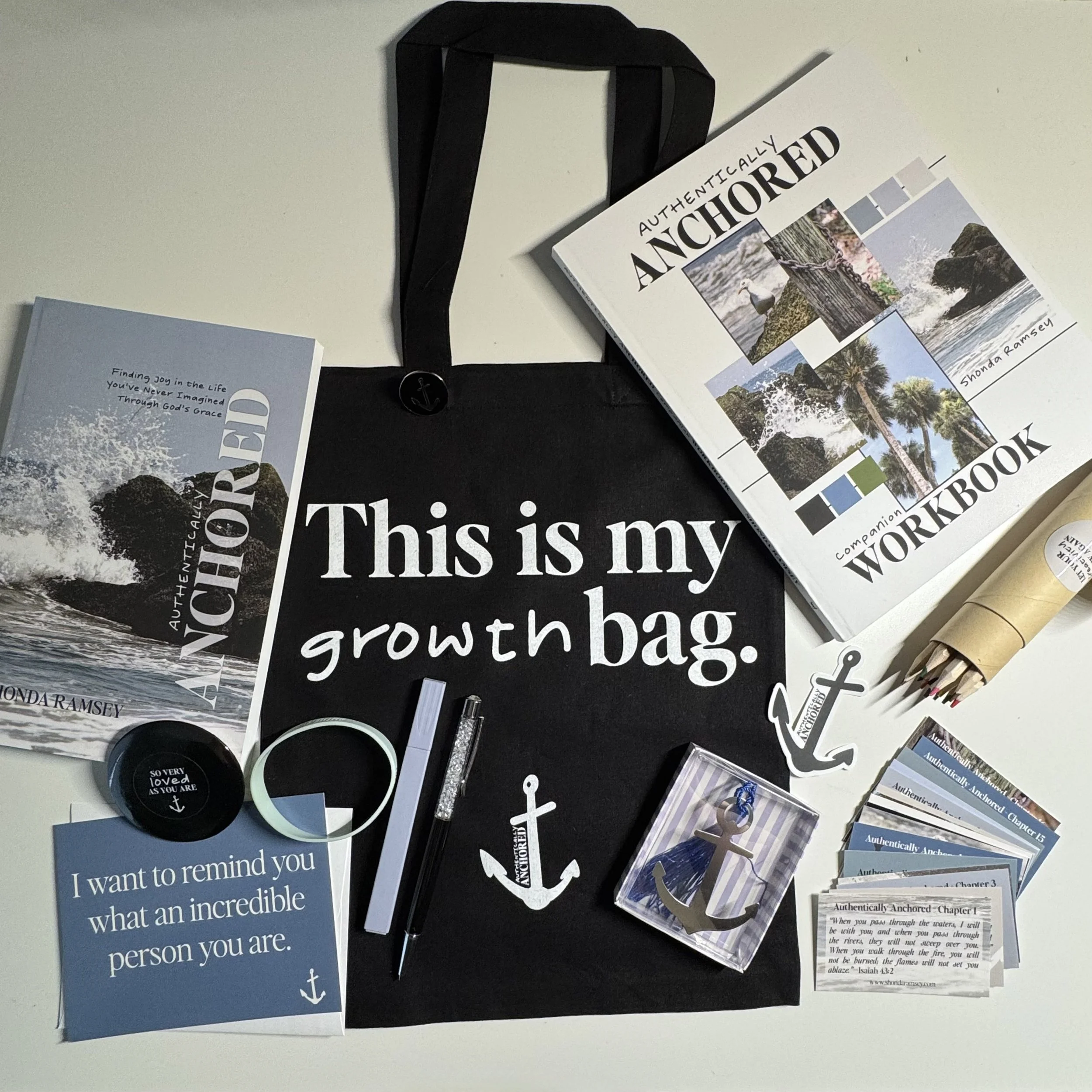 totebag, books, postcards, arrow bookmark, mirror, bracelet, stickers, scripture cards, and colored pencils