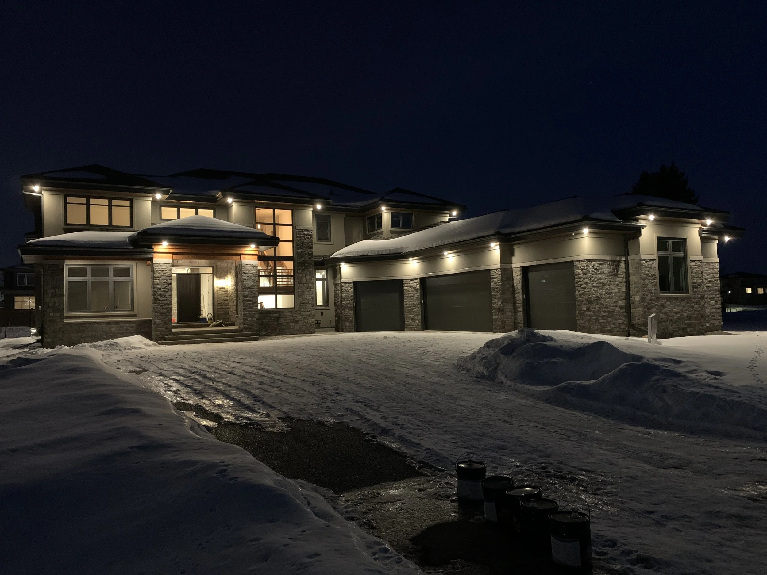 A large house that is lit up at night