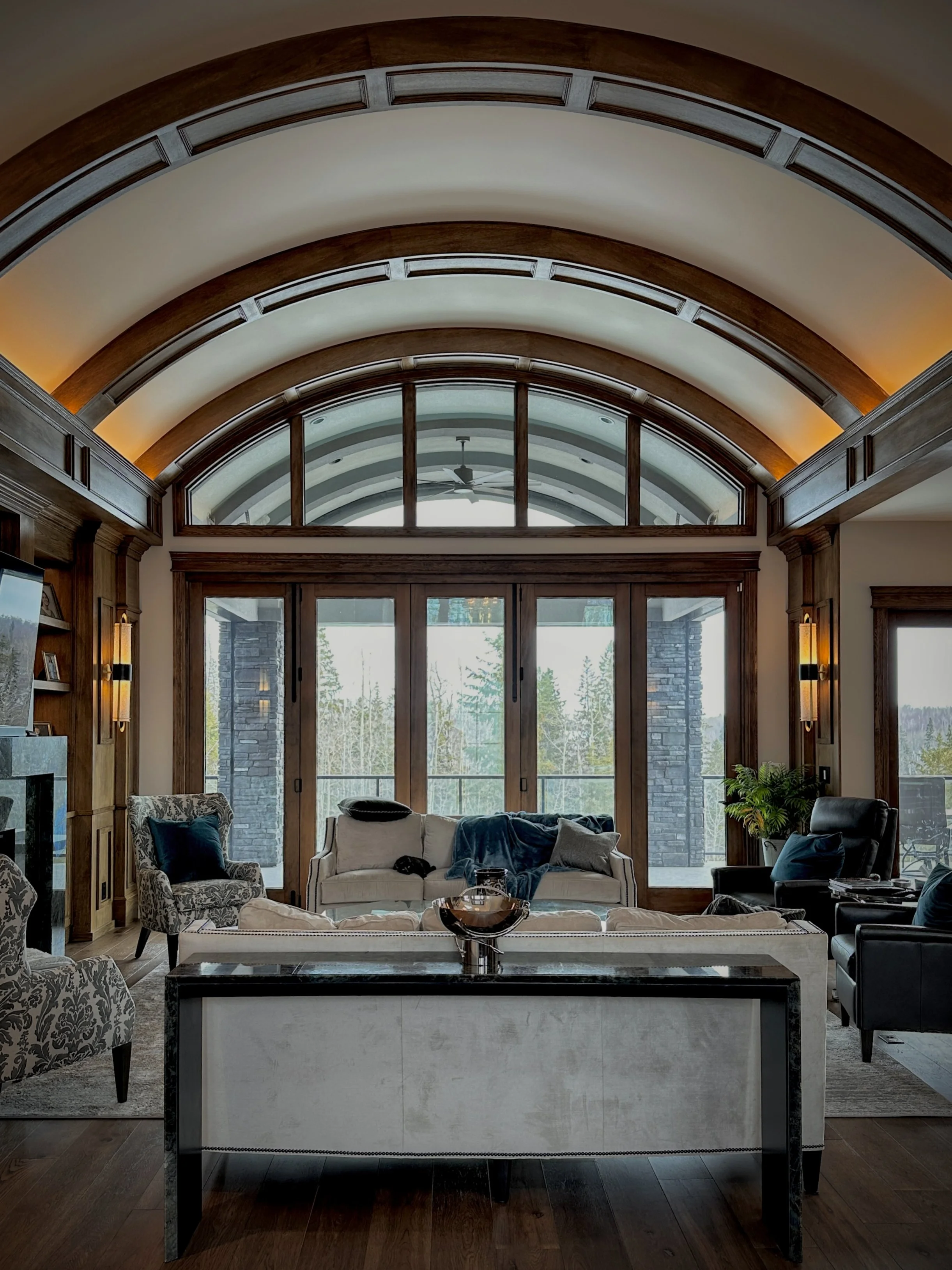 The back of a large house with an upper balcony