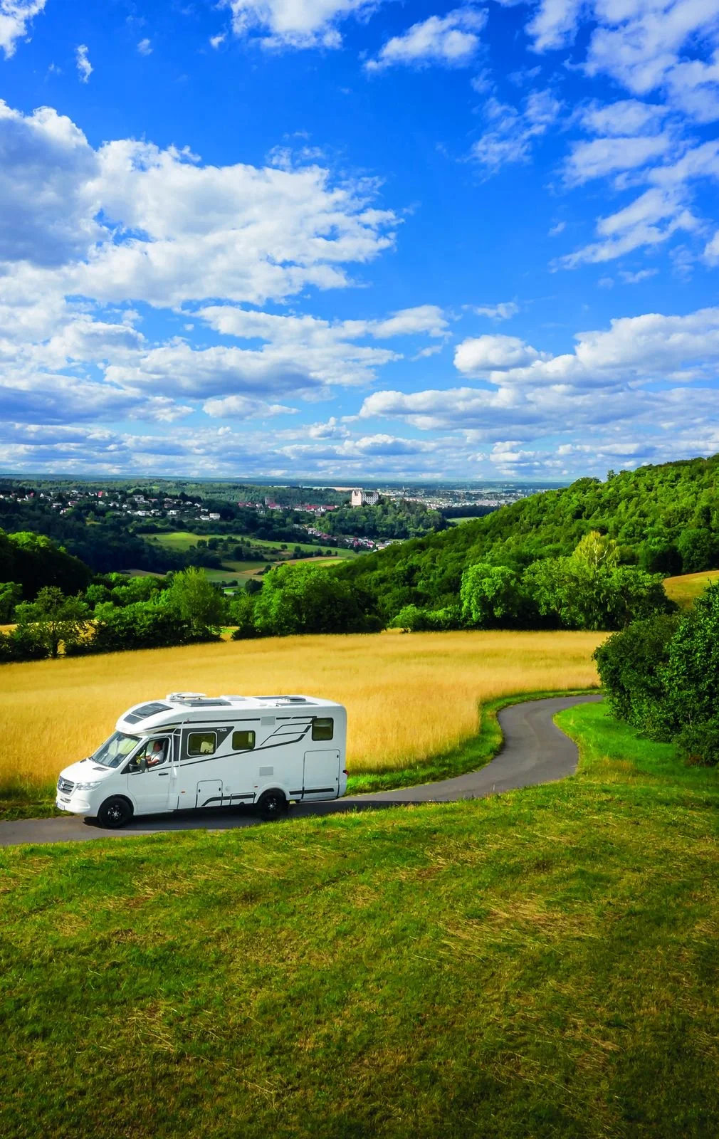 Campervan parked in green countryside