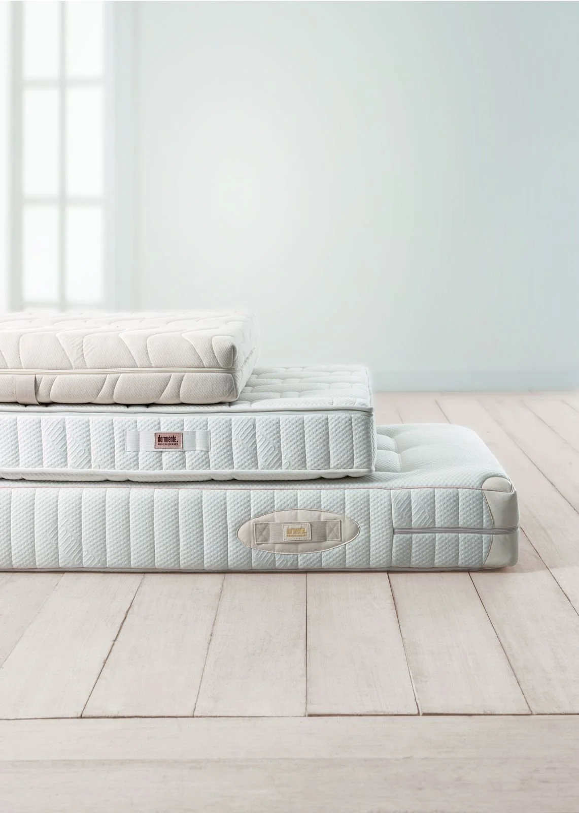 Stack of Dormiente natural latex mattresses
