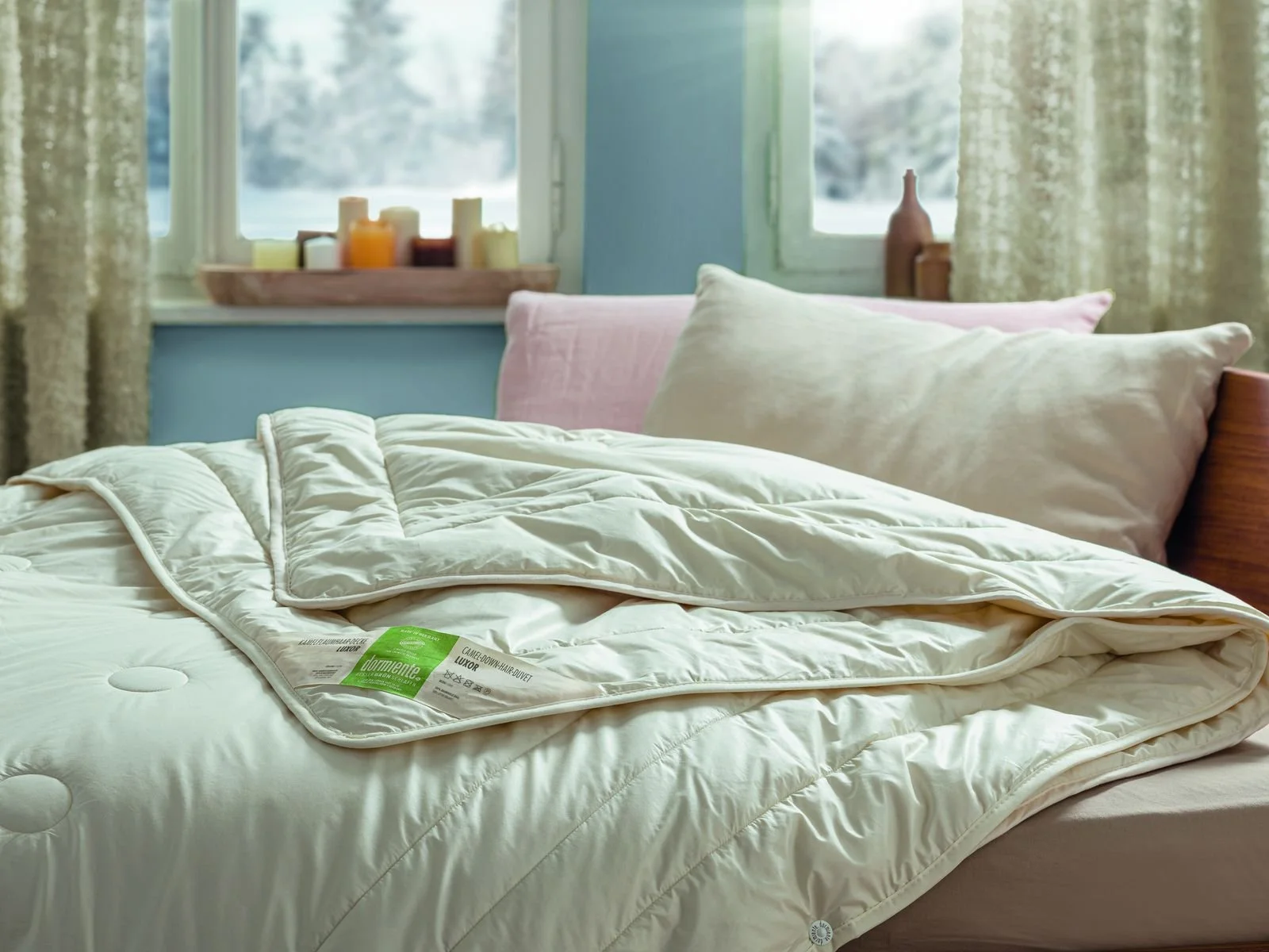 Natural wool duvet on a solid wood bed