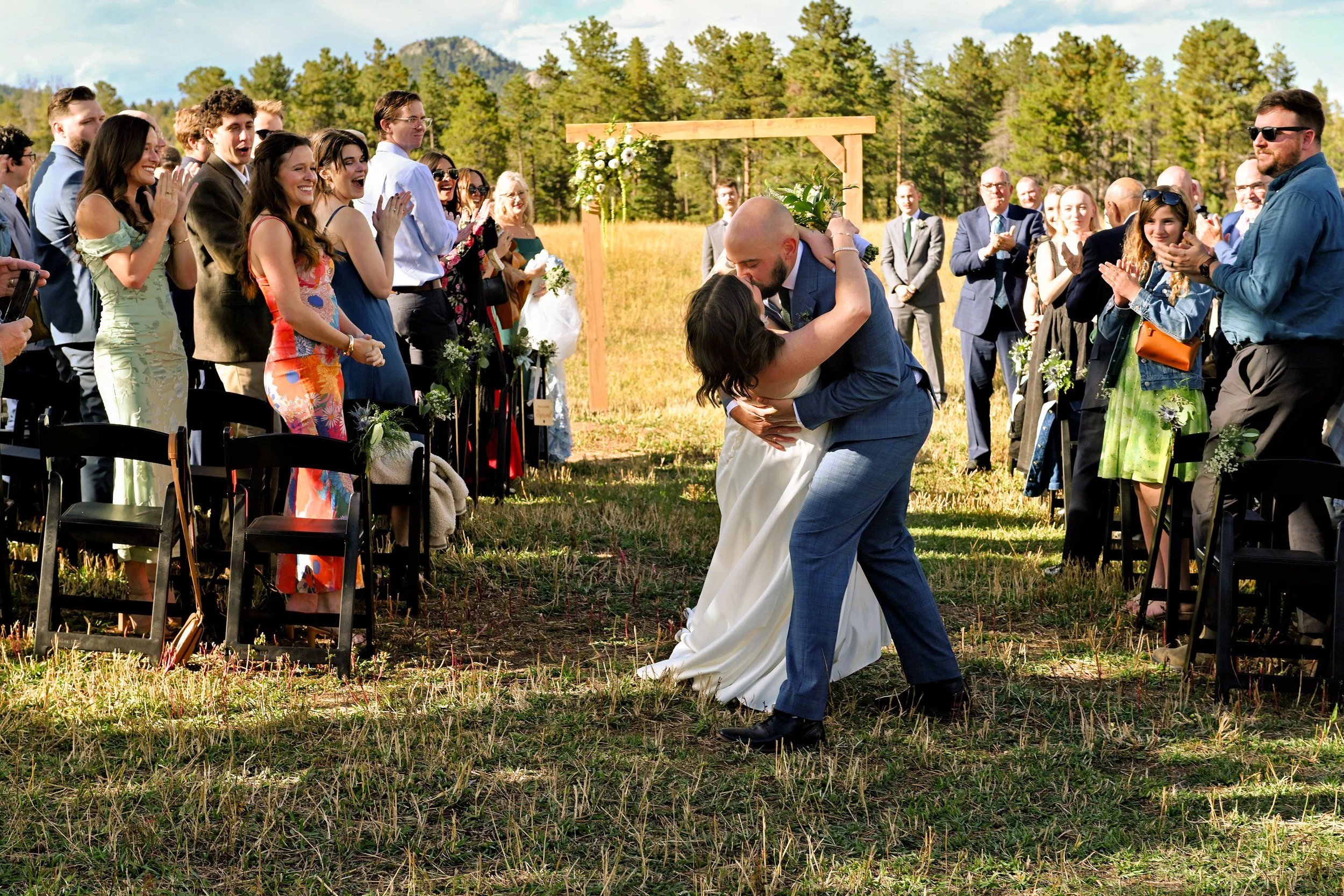 Bride and groom married in the meadow at a ranch in Conifer, CO.