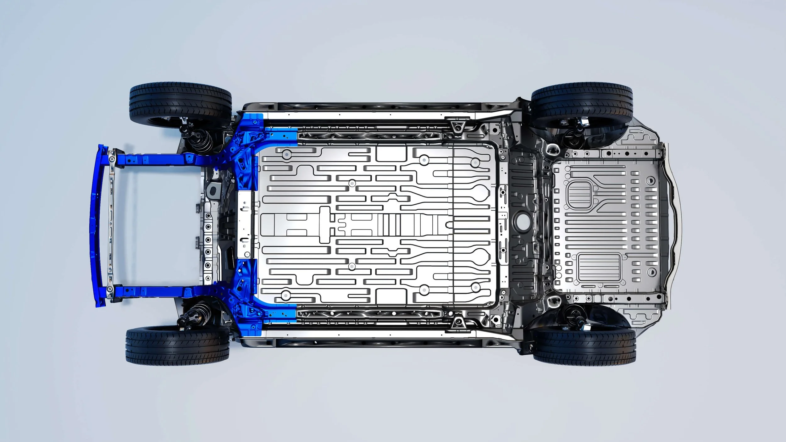 Vista superior de un automóvil eléctrico visto desde abajo, mostrando la estructura y componentes internos.