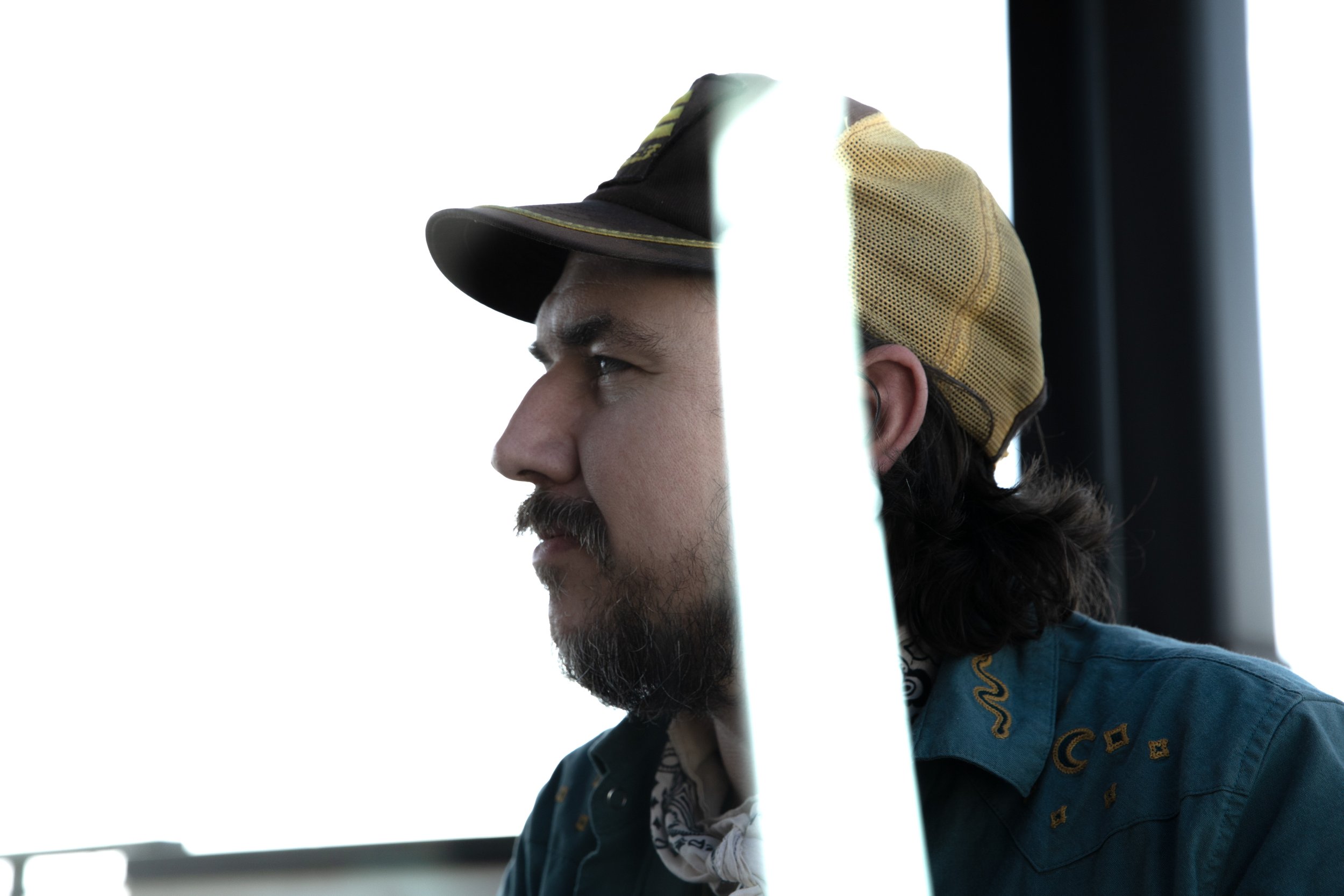 A photograph of folk artist Susto from a photography session with his band Susto Stringband.