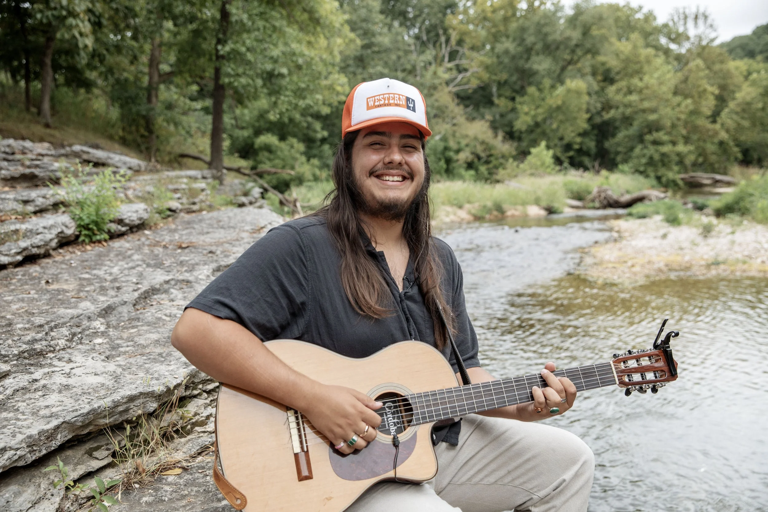 Native american country artist Agalasiga, Chuj, Mackey photographed along a creek on his family land outside Tulsa, Oklahoma.