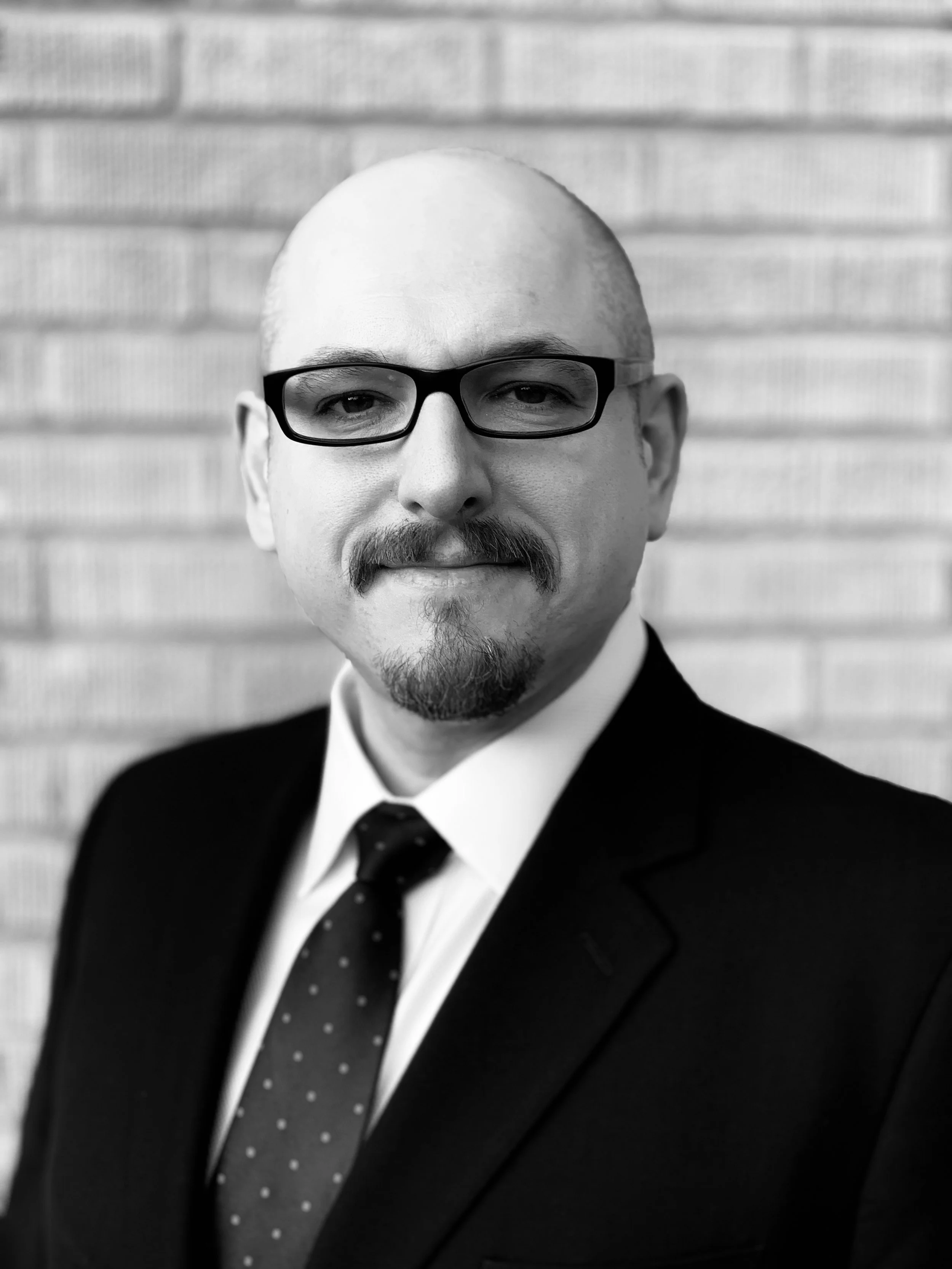 Black and white portrait of a Daniel Dobrygowski.