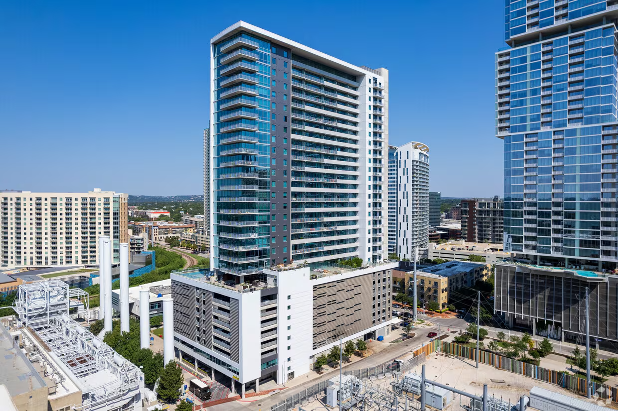 Sky full of tall modern glass buildings in an urban cityscape.