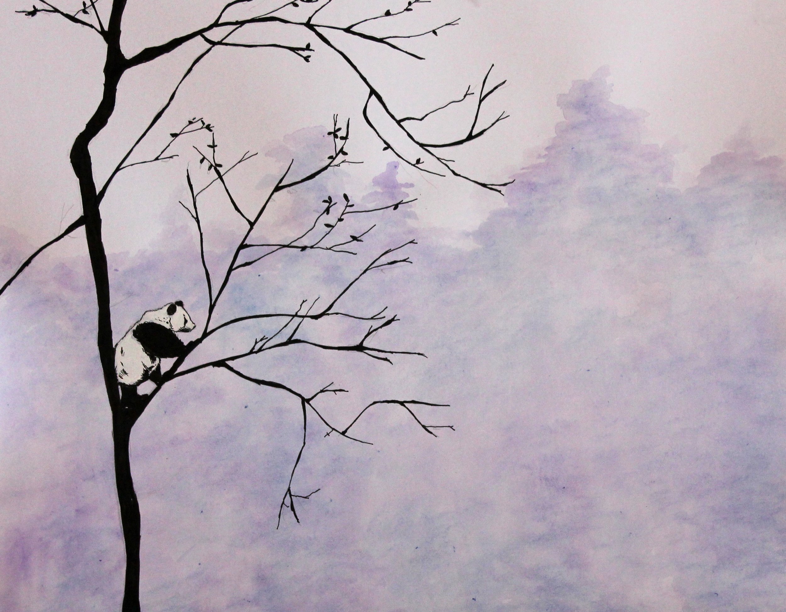 A panda bear sitting on a branch of a leafless tree against a cloudy sky background.