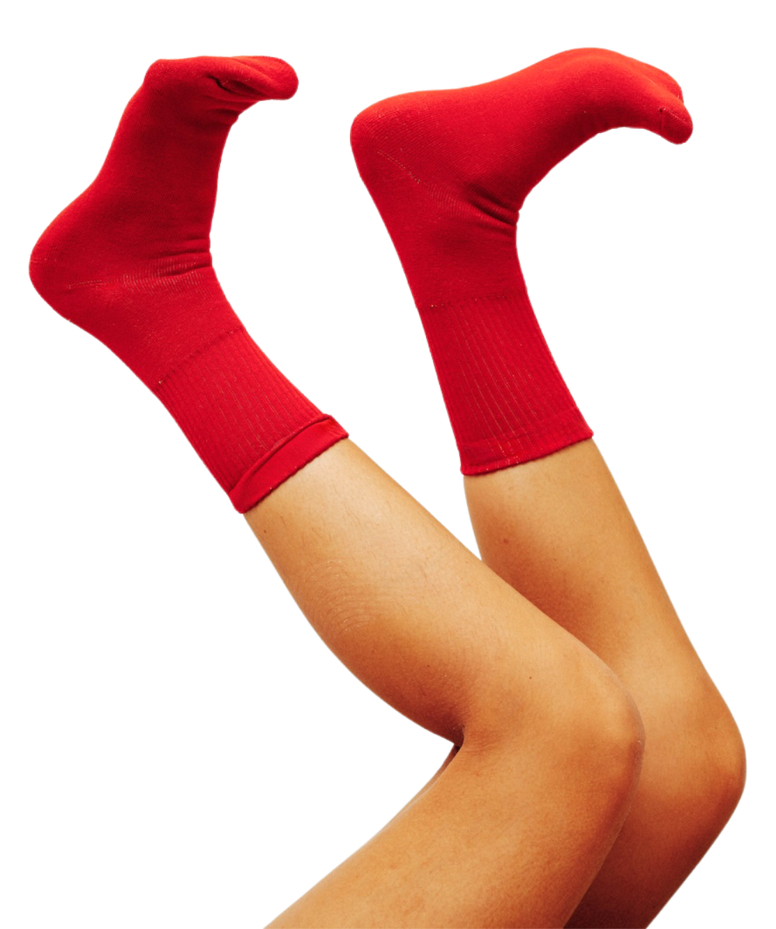 Person's legs and feet wearing red socks, with knees bent and feet pointing upward.