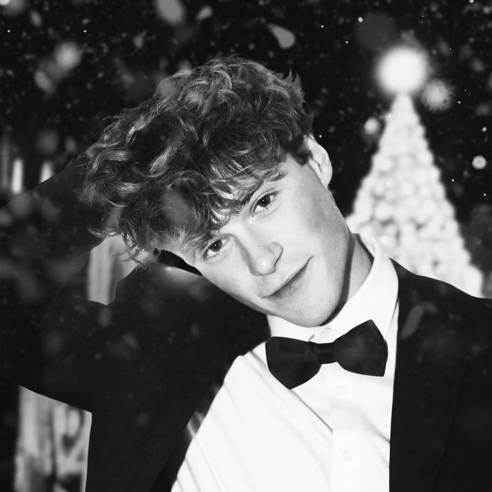 Tanner grigoli wearing a tuxedo and bowtie or this "All I Want For Christmas Is You" cover song artwork