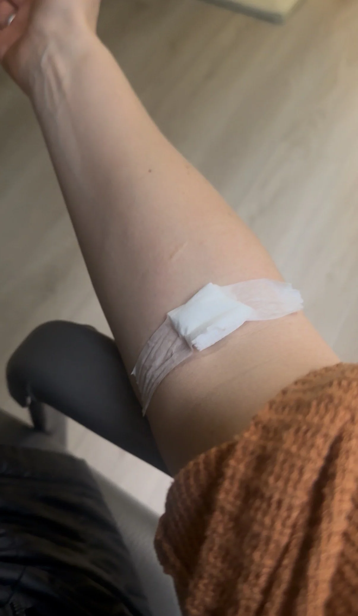 arm with bandage from blood draw