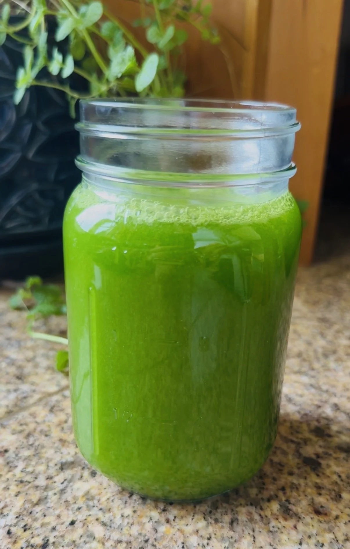 green juice in glass jar
