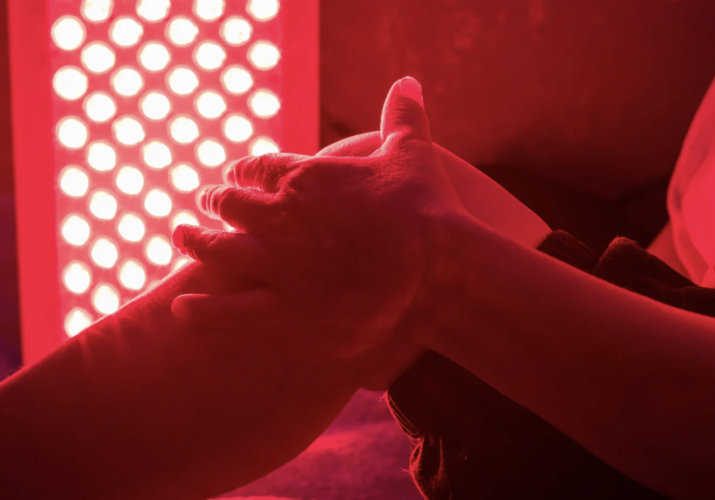 red light being directed toward knee